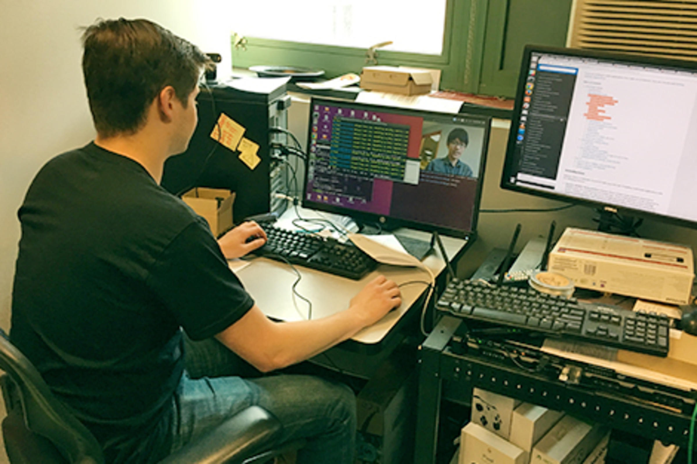 Justin Trugman works at a computer in Blink CDN's offices.
