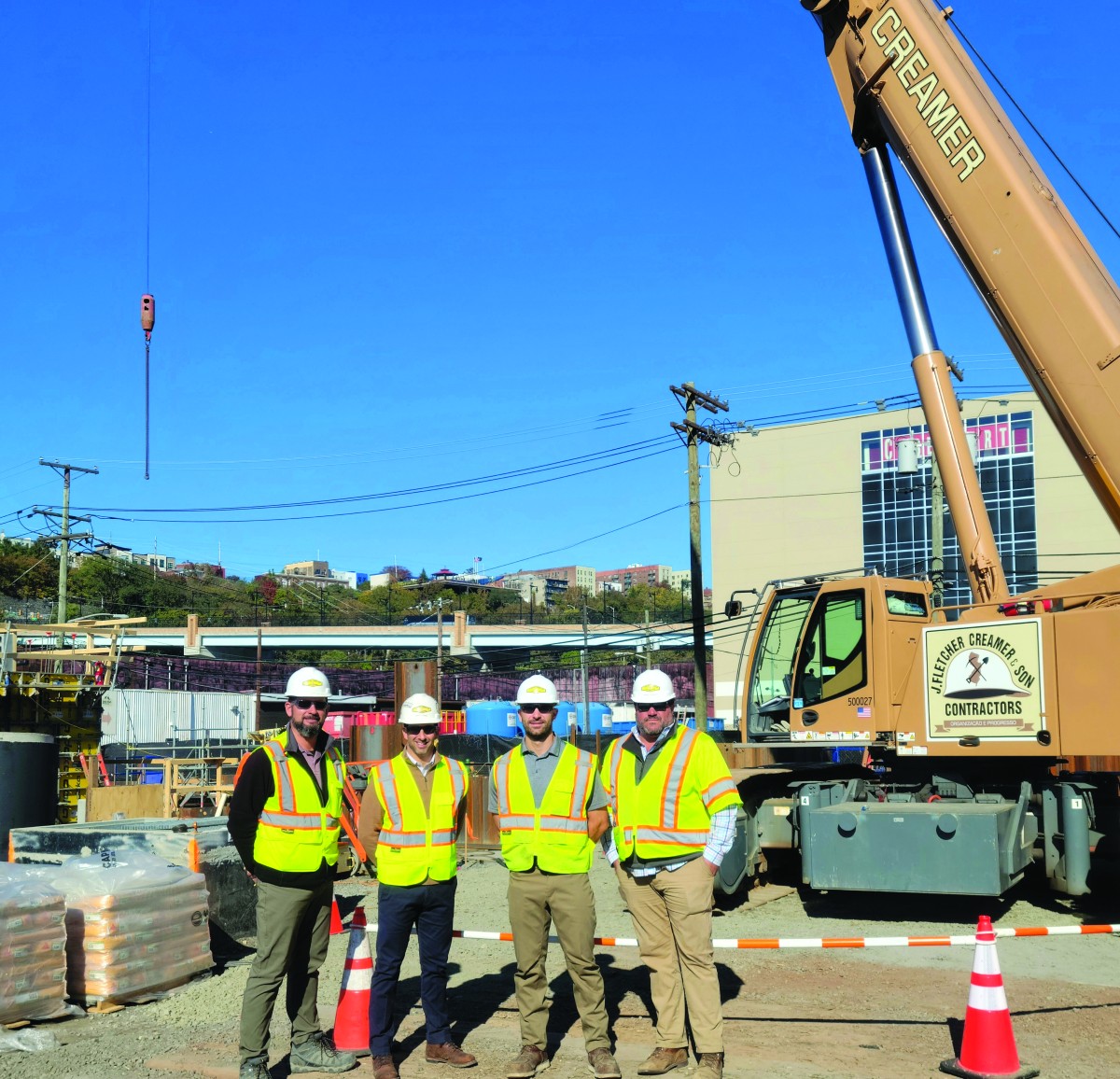 Downs and three other men at a construction site