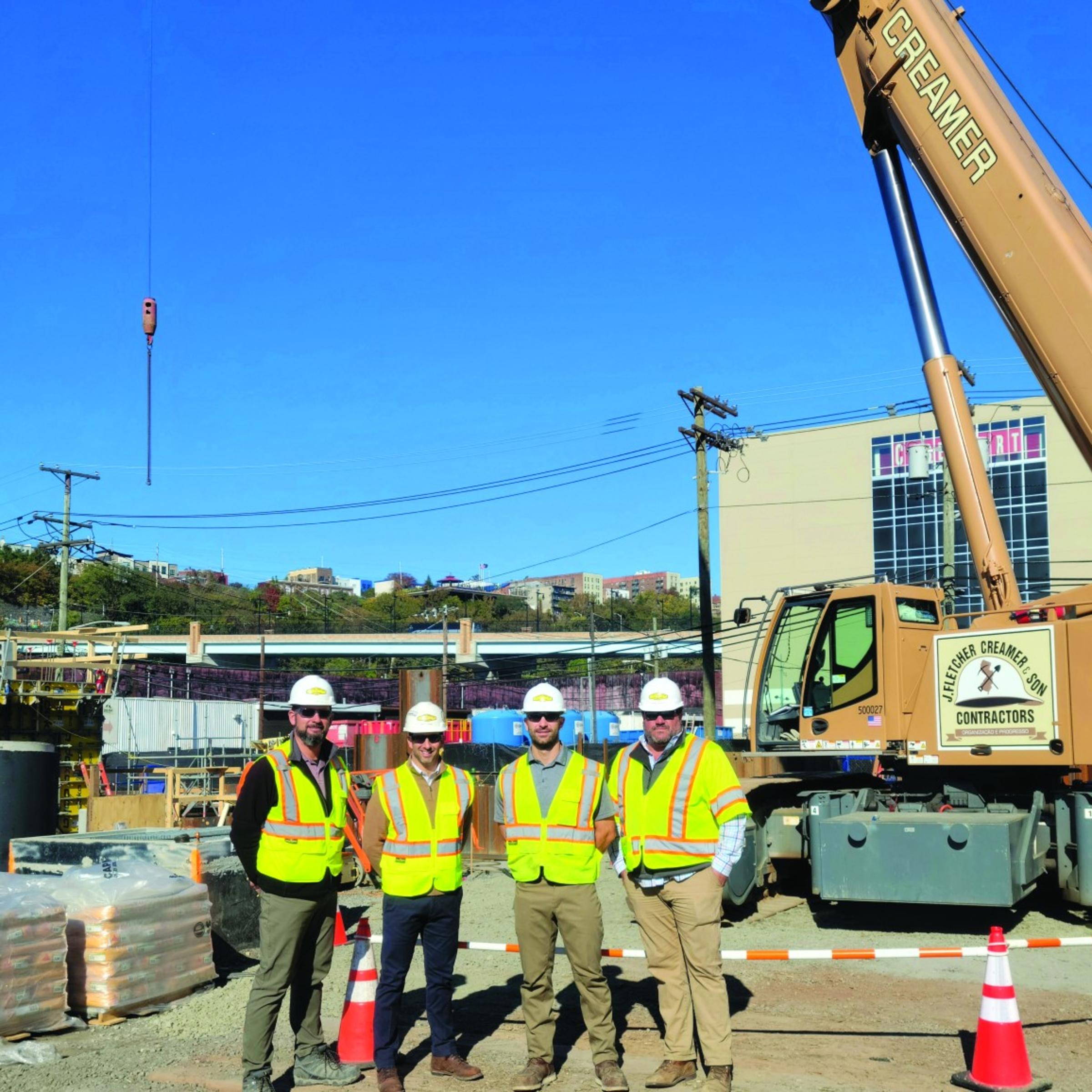 Downs and three other men at a construction site