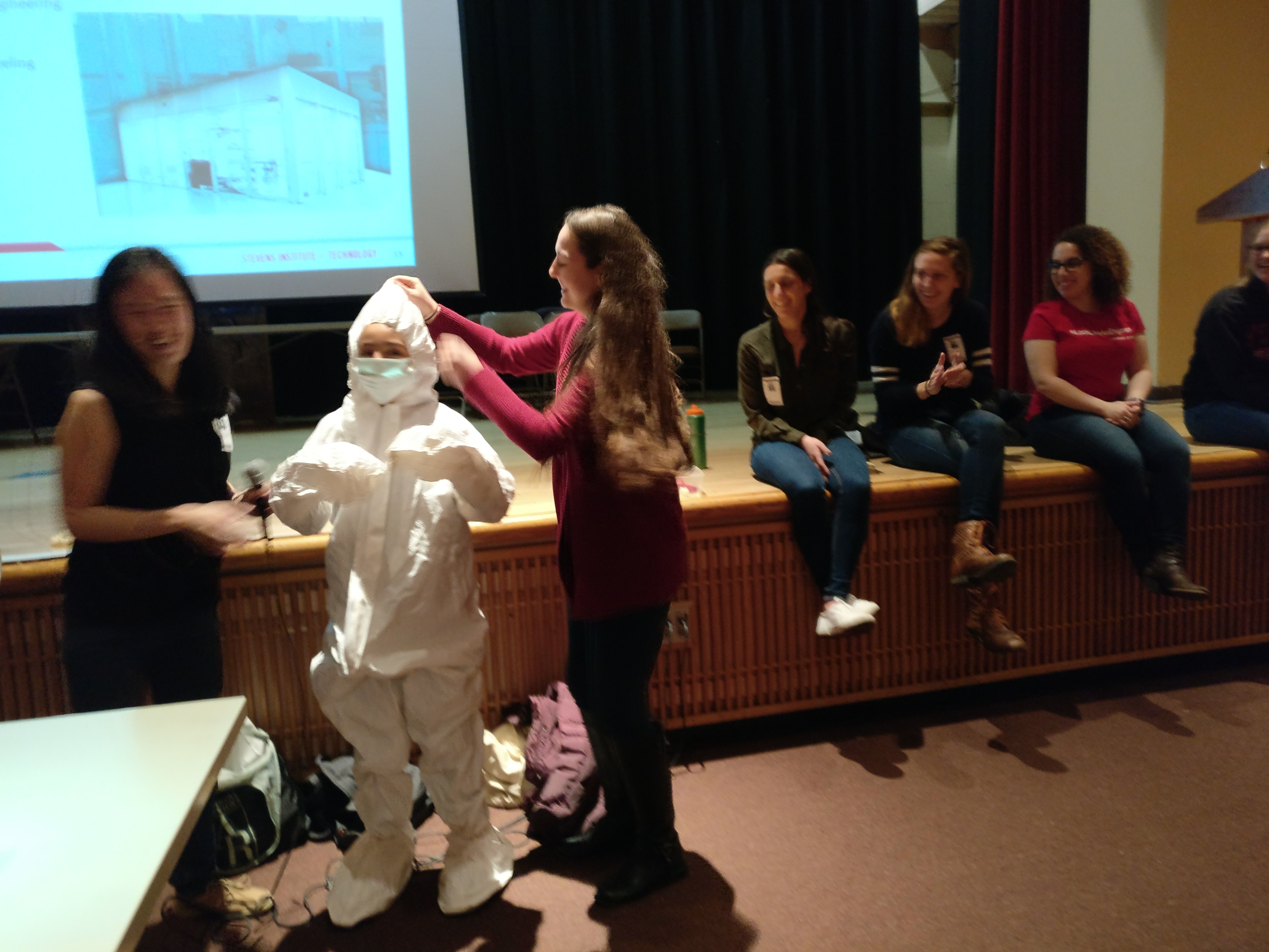 Middle school student wearing clean suit