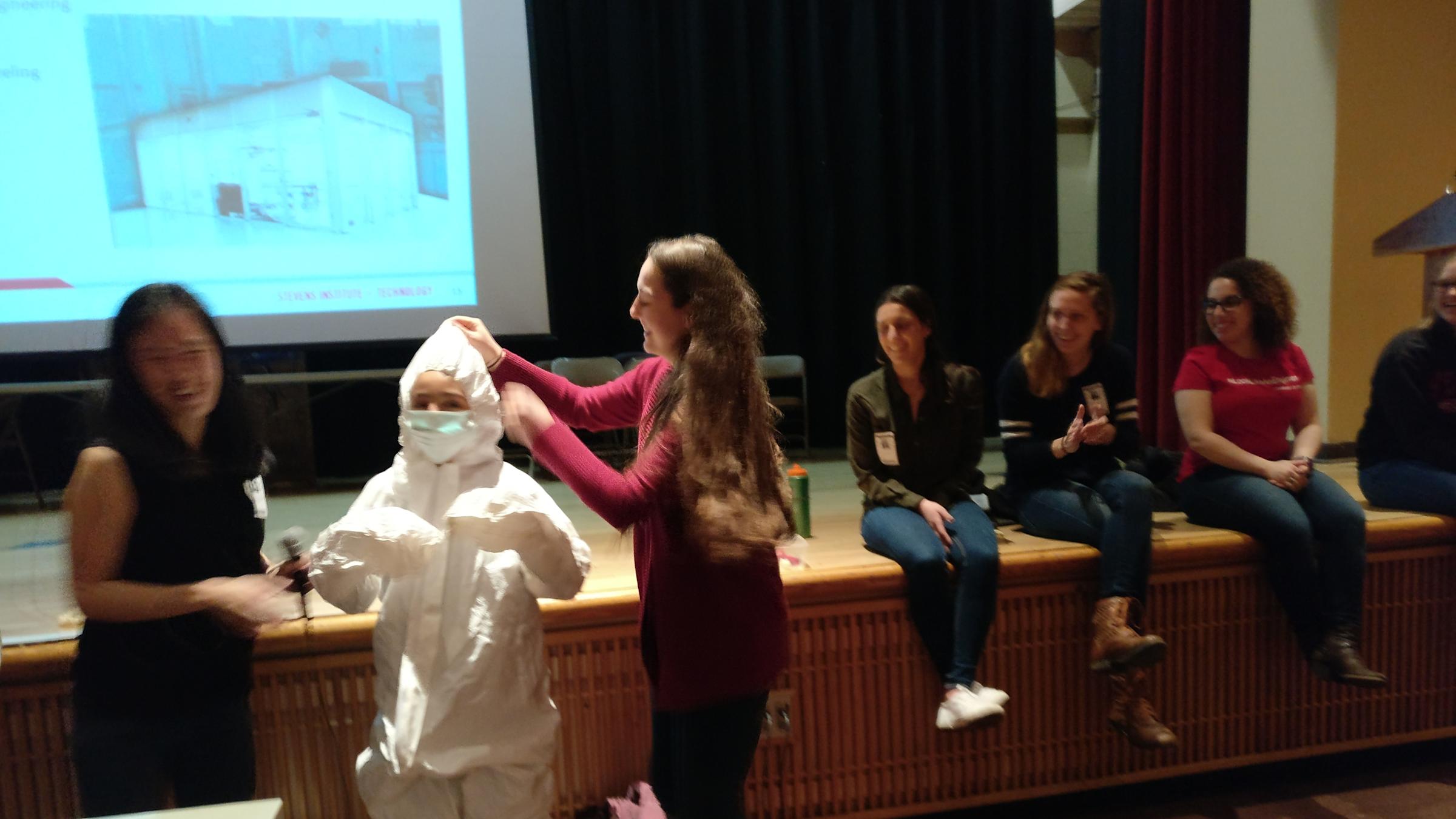 Middle school student wearing clean suit