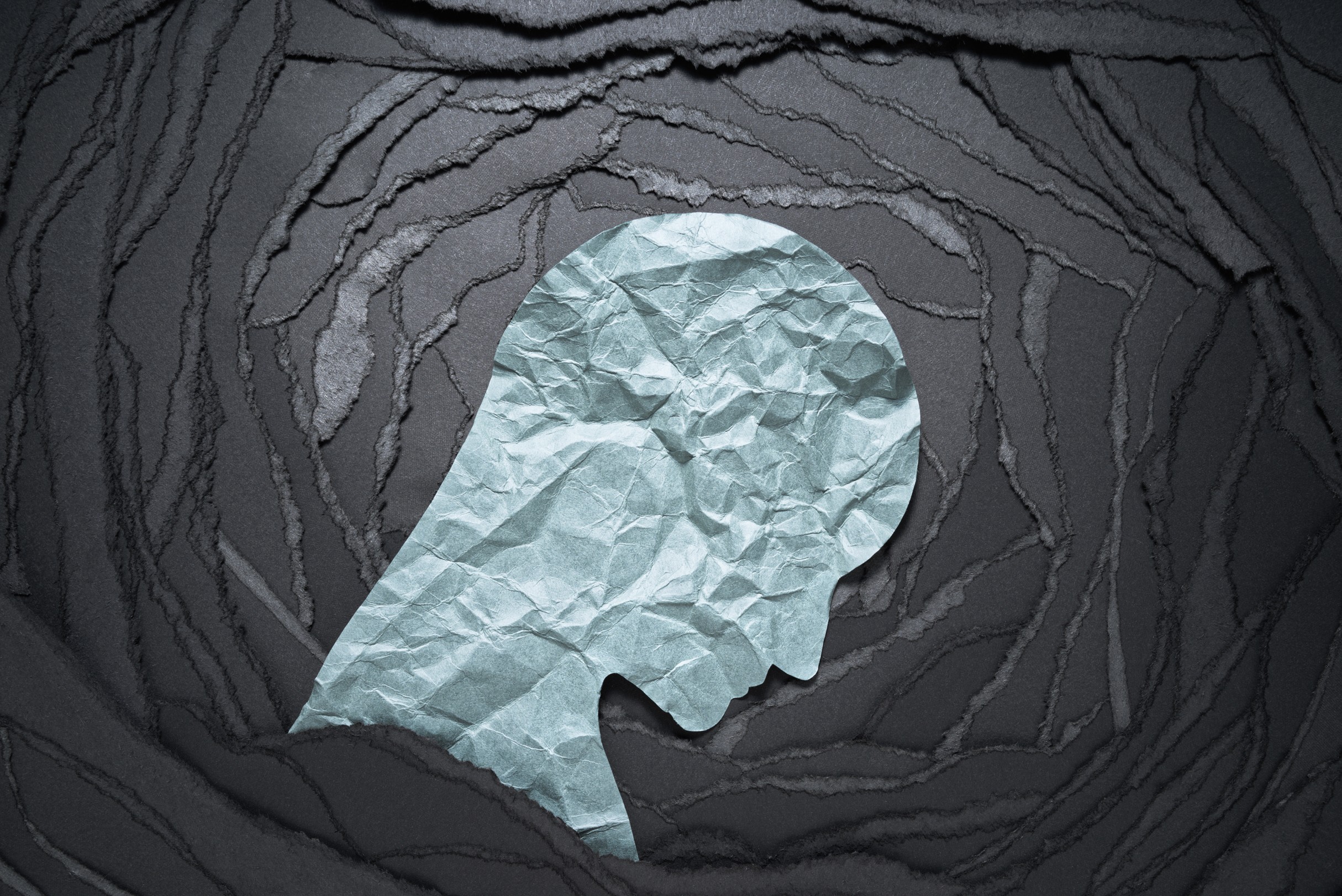 a sad face made of paper