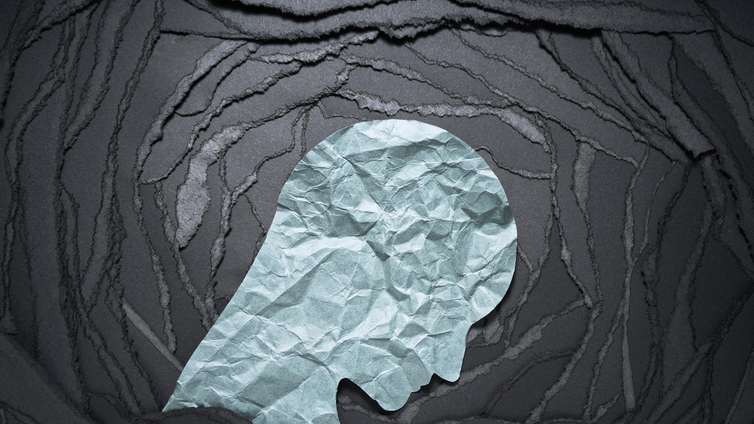 a sad face made of paper