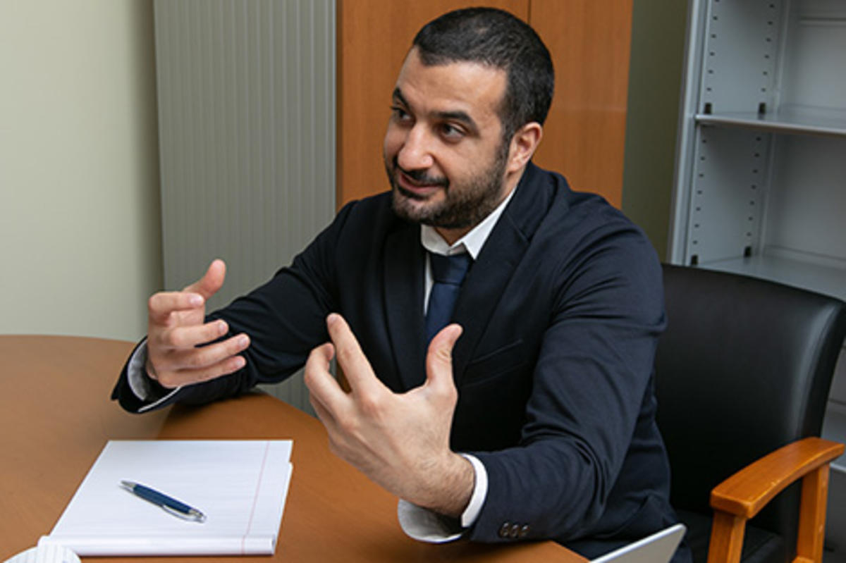 Majeed Simaan teaching at a desk