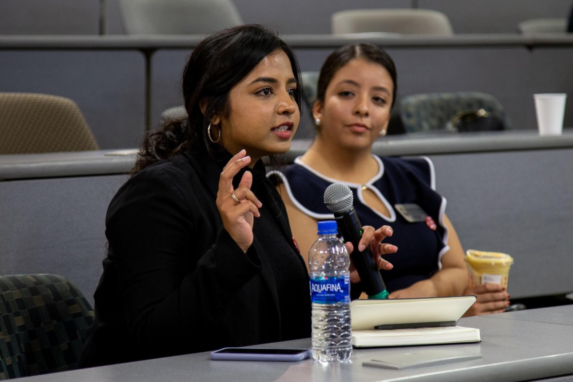 Attendee asking a question to the speaker
