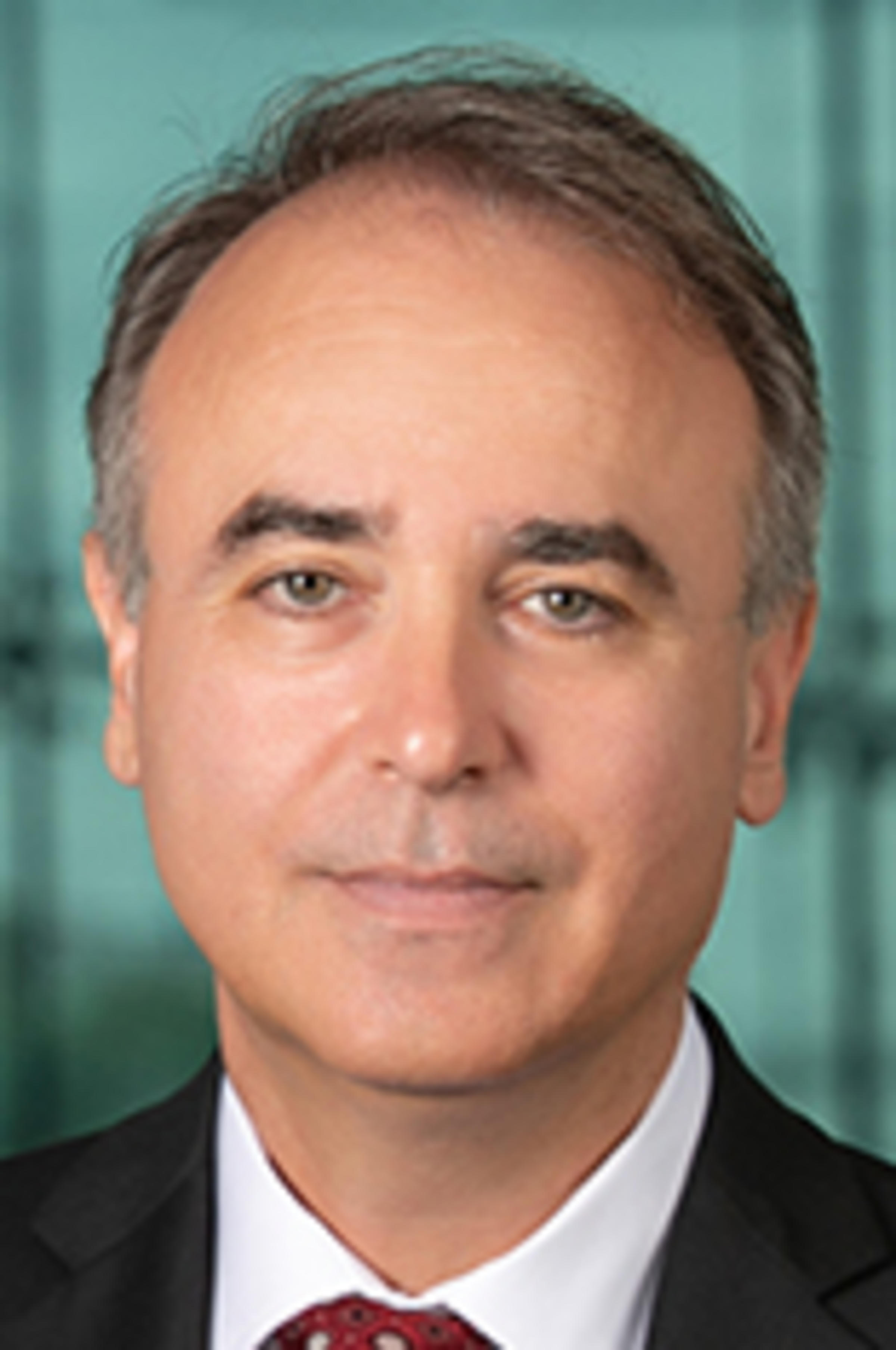 Headshot of Dan Pirjol