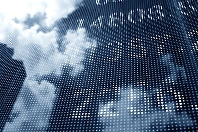 Stock image of financial numbers on a building