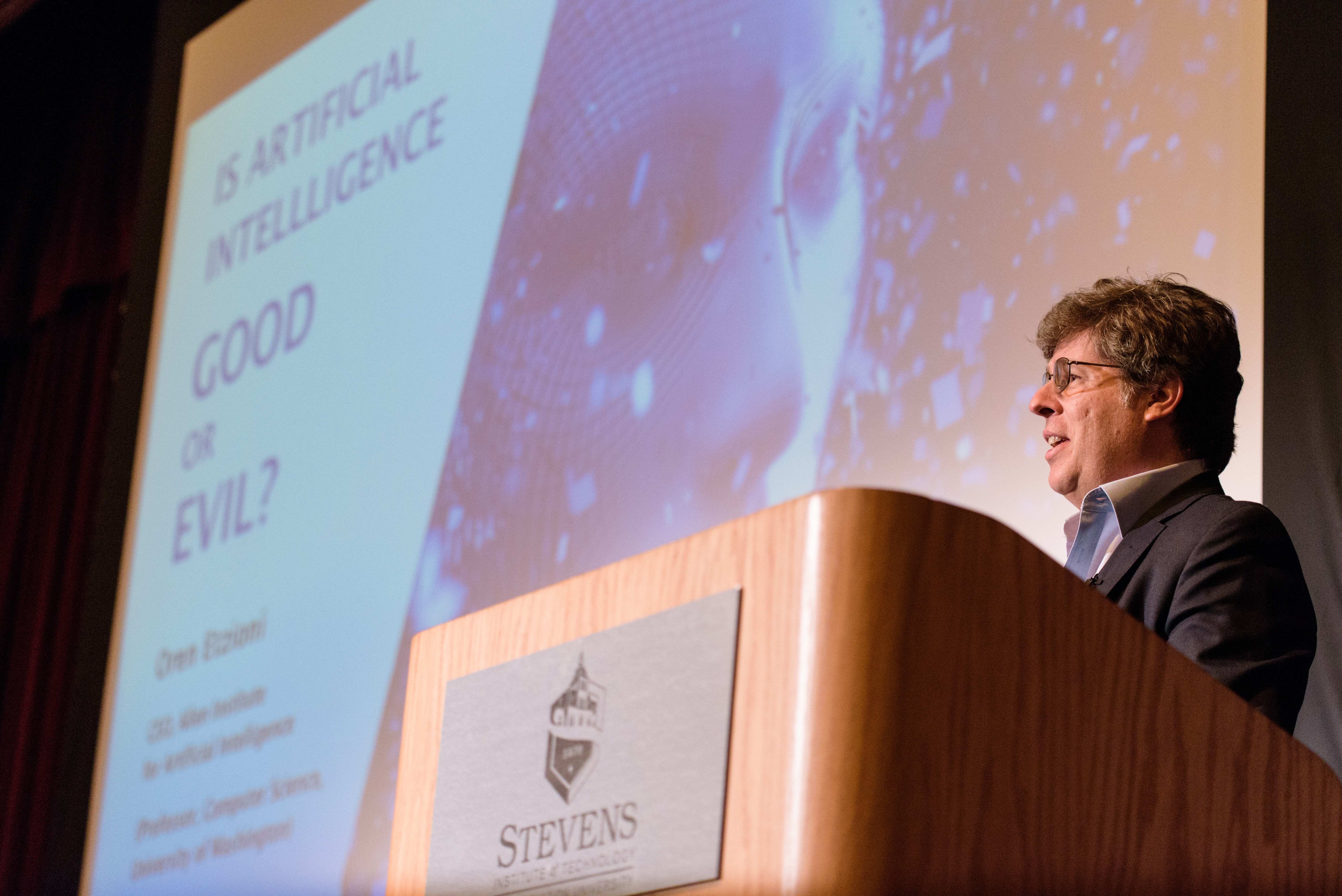 Oren Etzioni standing at the podium at DeBaun Auditorium