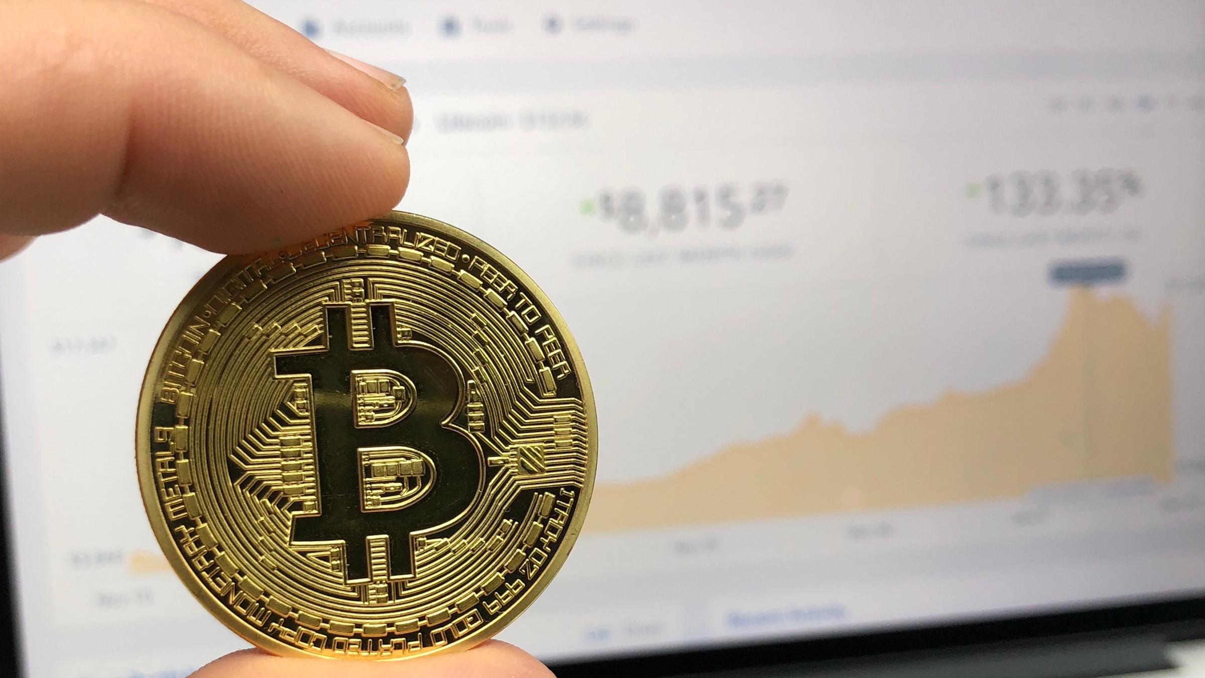 Photo of coin and computer