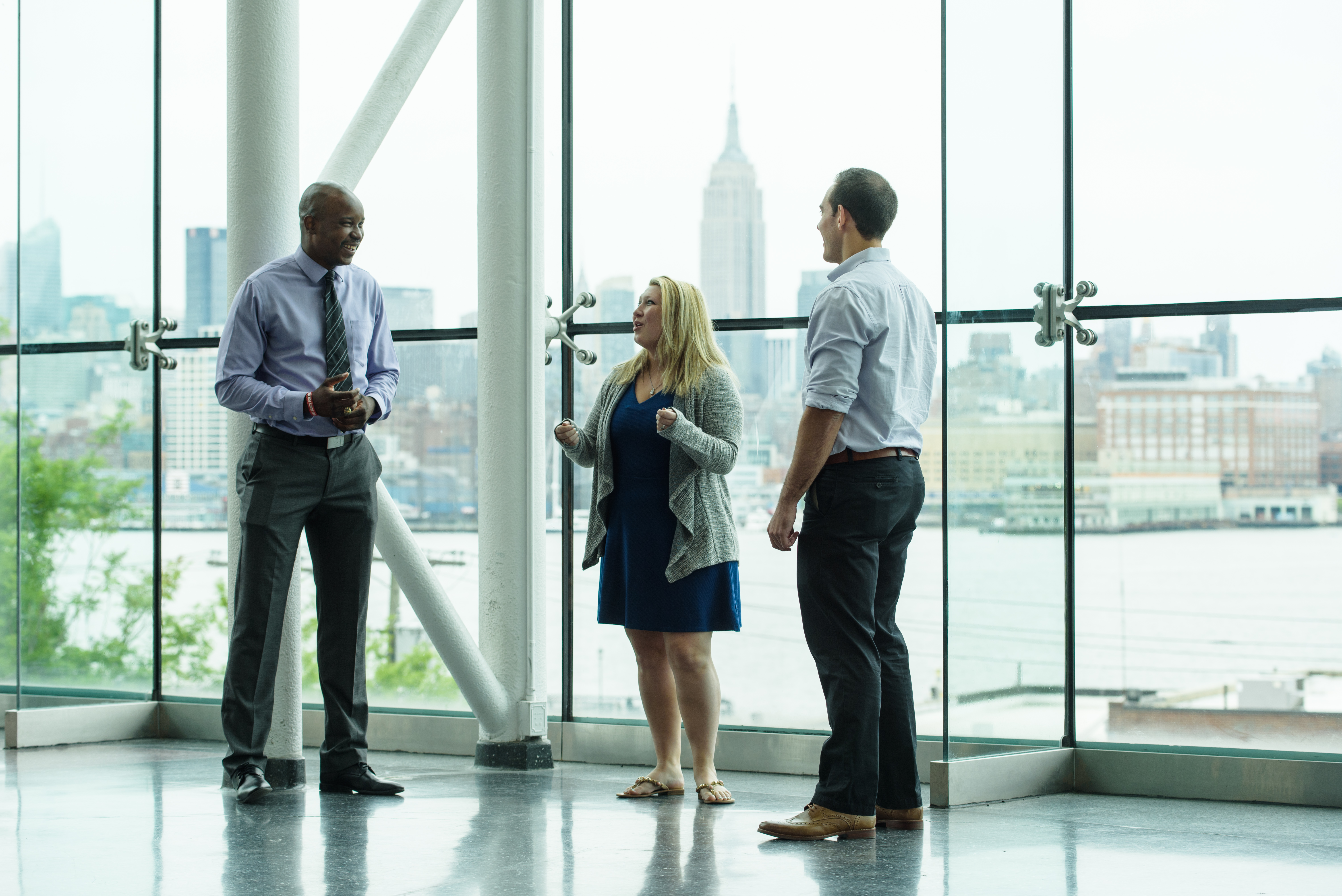 3 graduate students in Babbio Center lobby