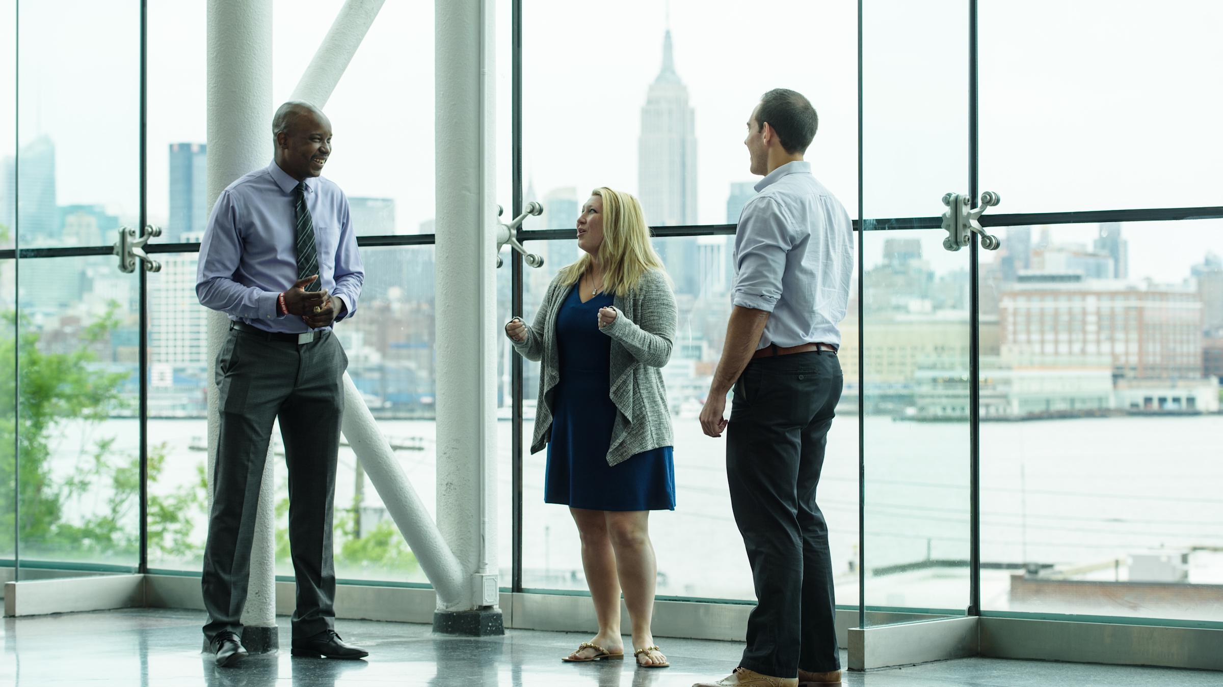 3 graduate students in Babbio Center lobby