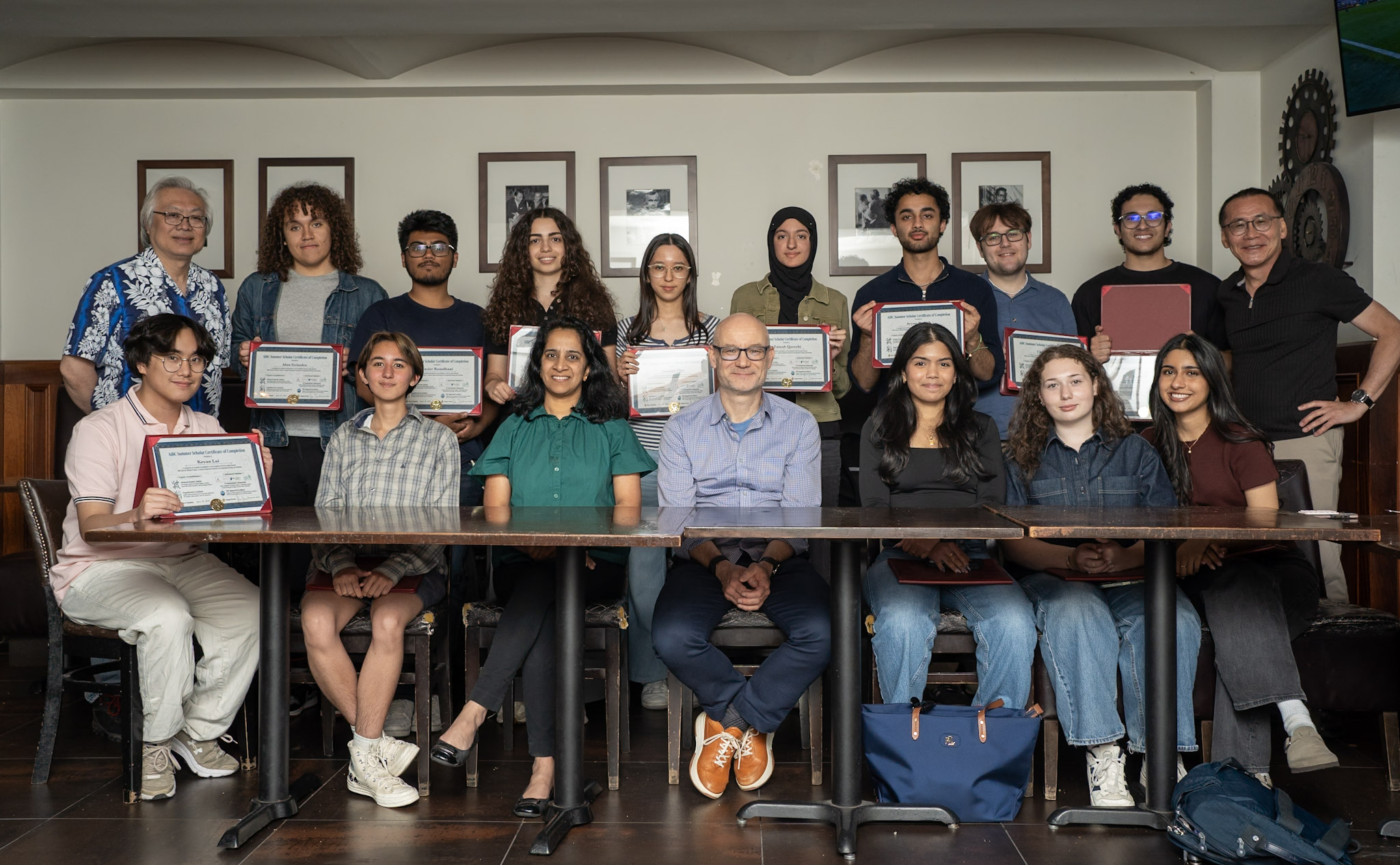 Faculty members Kenny Wong (first, standing left), Sesha Sridevi Alluri and Marcin Iwanicki (seated third and fourth from left) and Woo Lee (standing, first at right) post with AiBC scholar stduents..