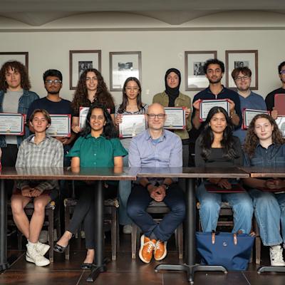 Faculty members Kenny Wong (first, standing left), Sesha Sridevi Alluri and Marcin Iwanicki (seated third and fourth from left) and Woo Lee (standing, first at right) post with AiBC scholar stduents..