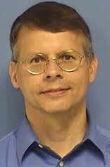 Headshot of Robert Zotti against a blue backdrop.