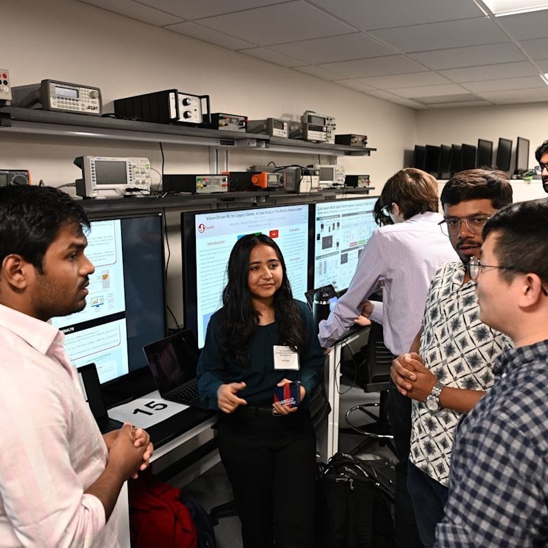 From left to right: Azizul Haque, Fiza Pathan, and Sudhanshu Kakkar discussing their project, "Multi-Class Depression Detection from User-Generated Text."