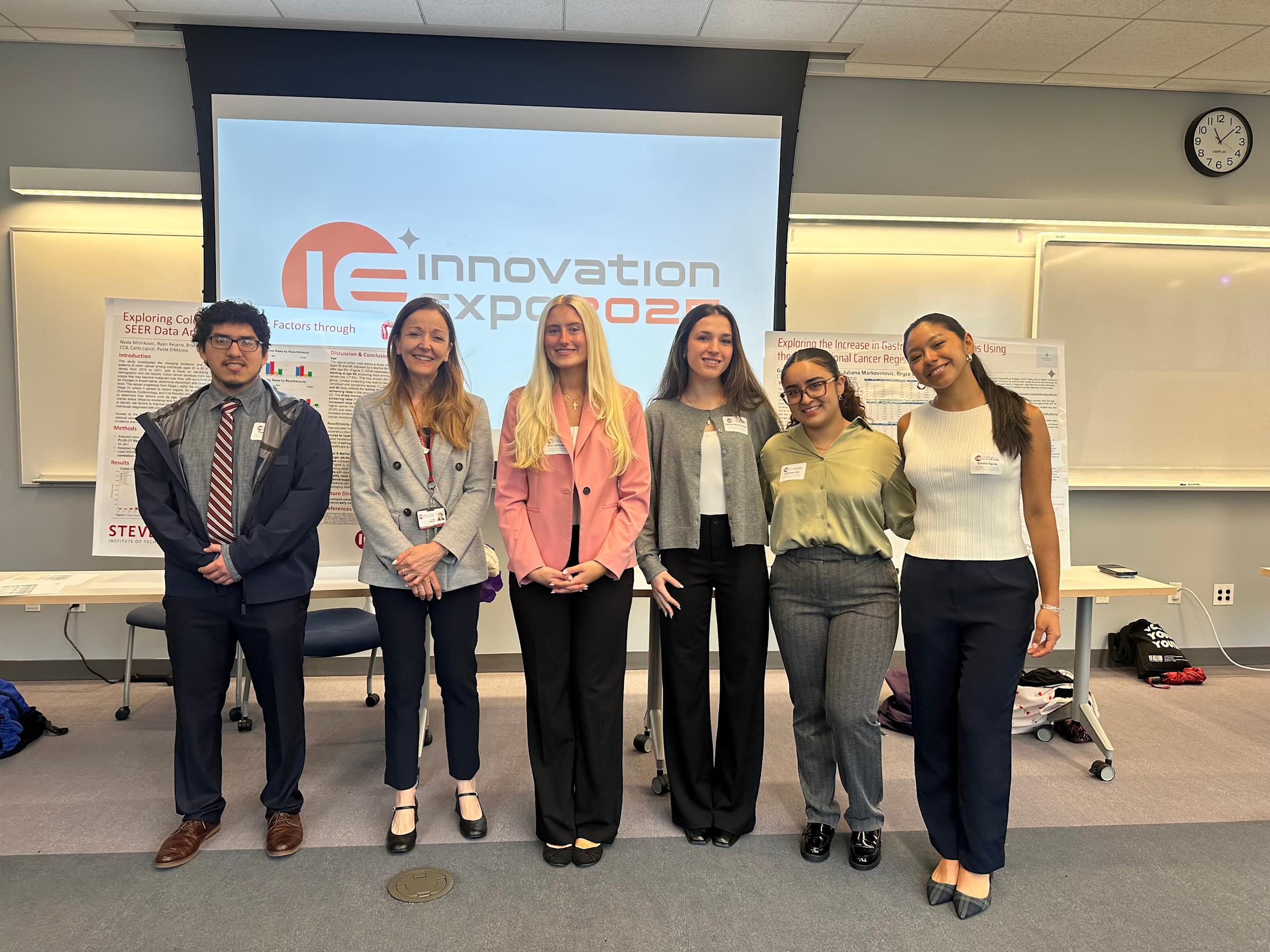 Paola DiMarzio and her students at innovation expo.