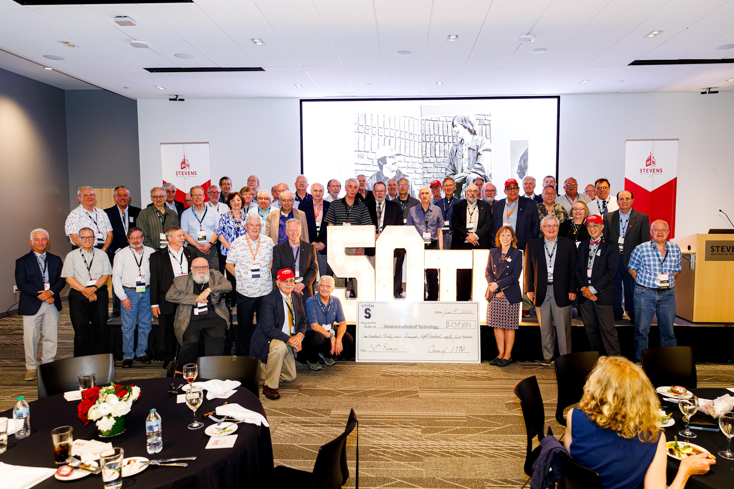 Members of the Class of 1976 pose for a group photo at 50th reunion