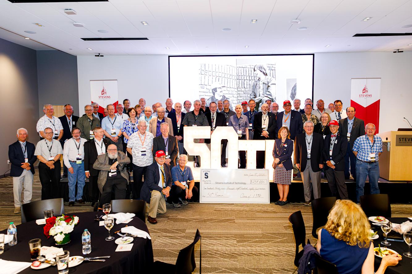 Members of the Class of 1976 pose for a group photo at 50th reunion