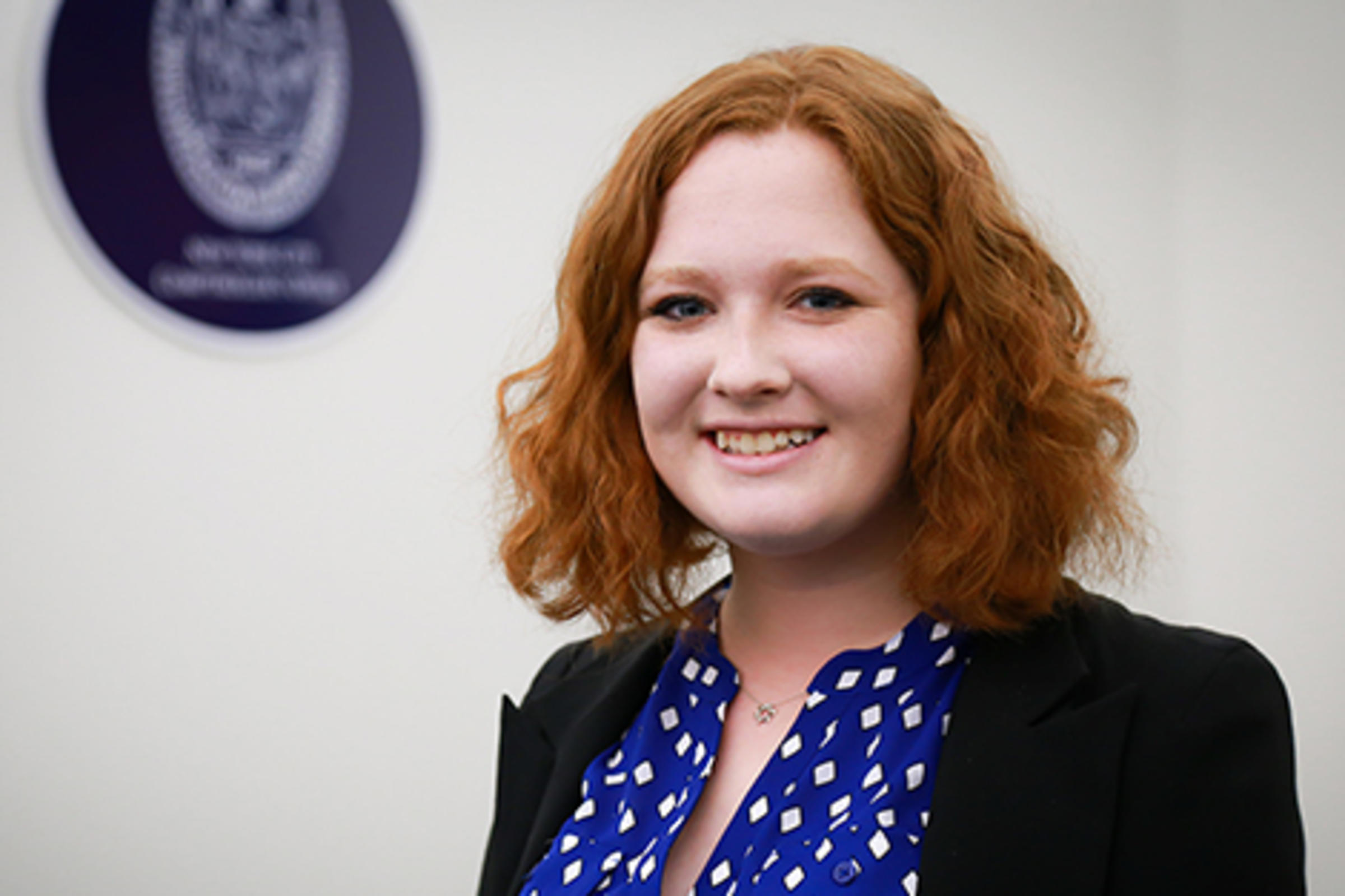 Victoria Piskarev in a blue dress at New York City's government offices,