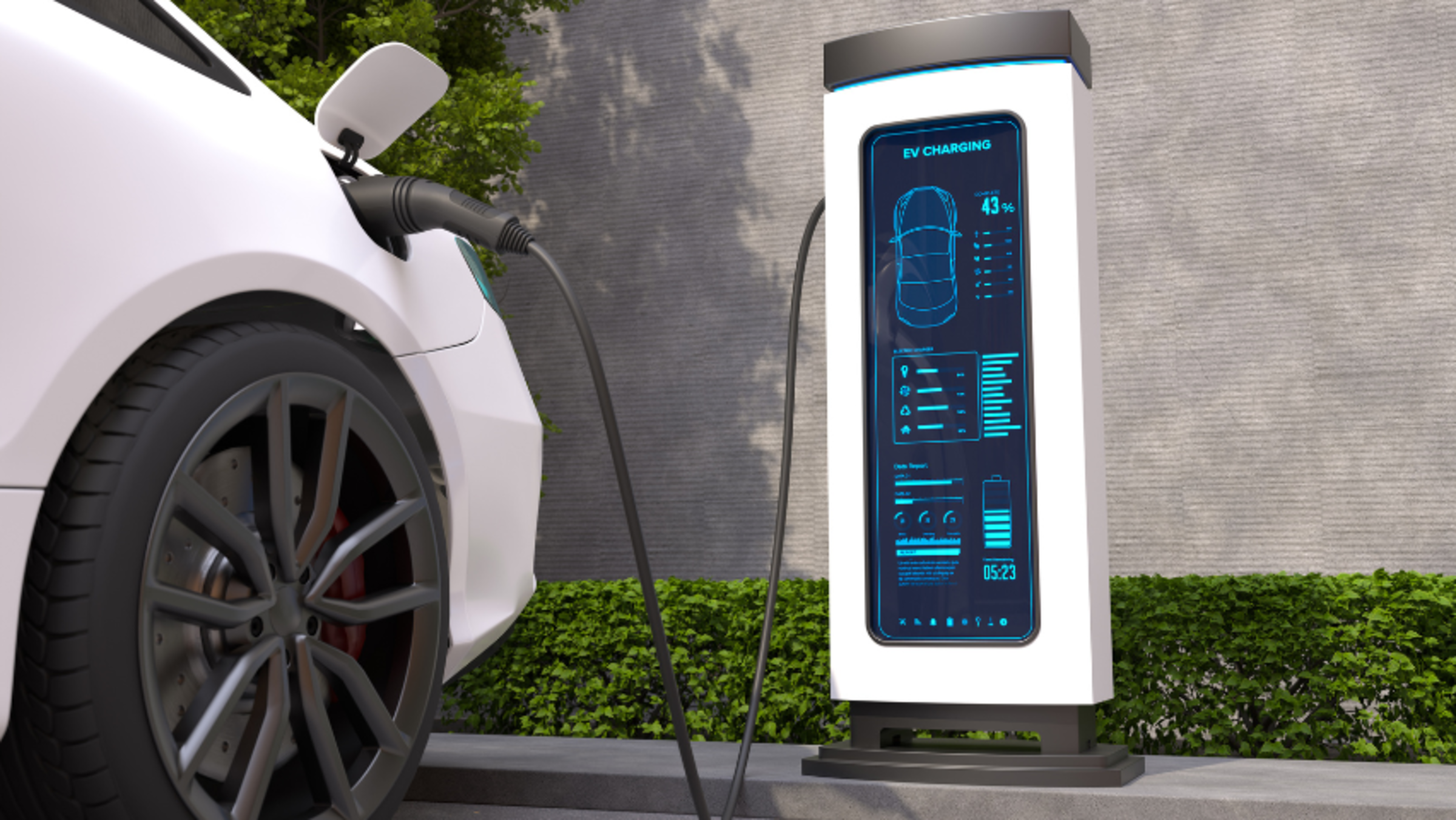A ground, front-wheel view of a car that is charging at a charging station.