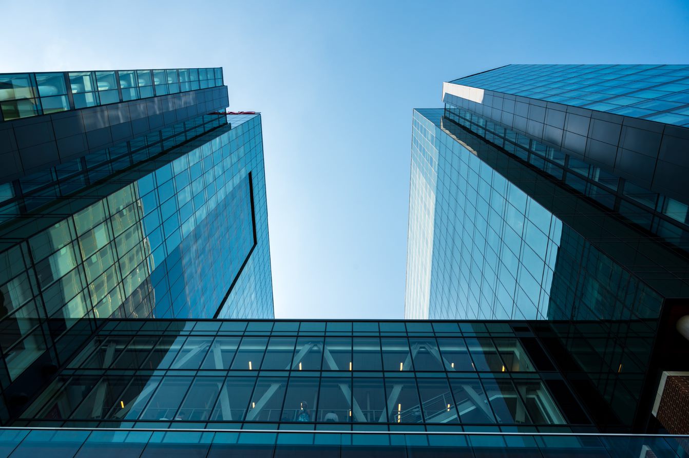 Industry Torchbearers Construction and Civil Engineering - glass side of the University Center Complex facing the blue sky above