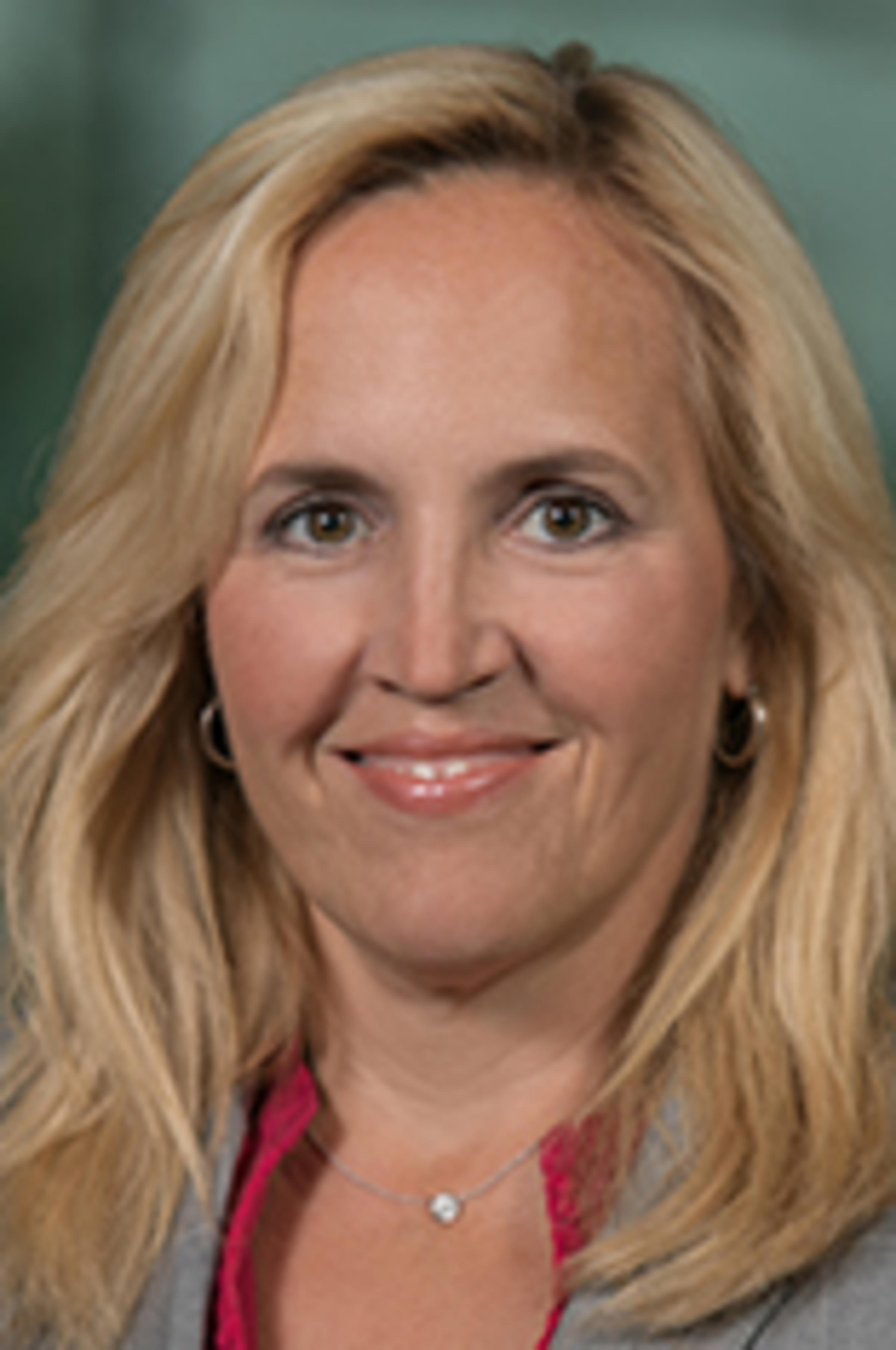 Headshot of Michelle Crilly with the New York skyline in the background.