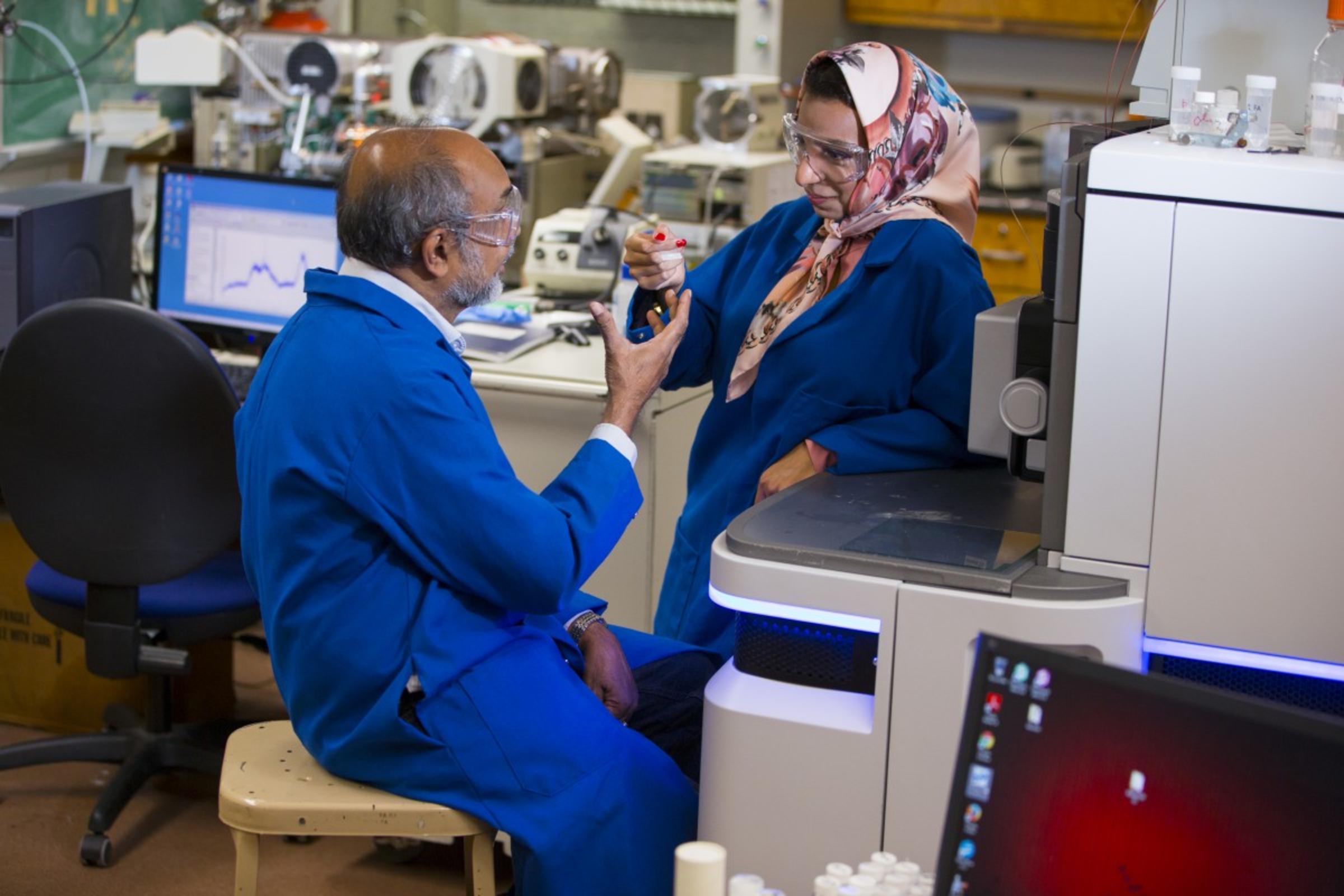 Athula Attygalle instructing a student in the Mass Spectrometry Laboratory