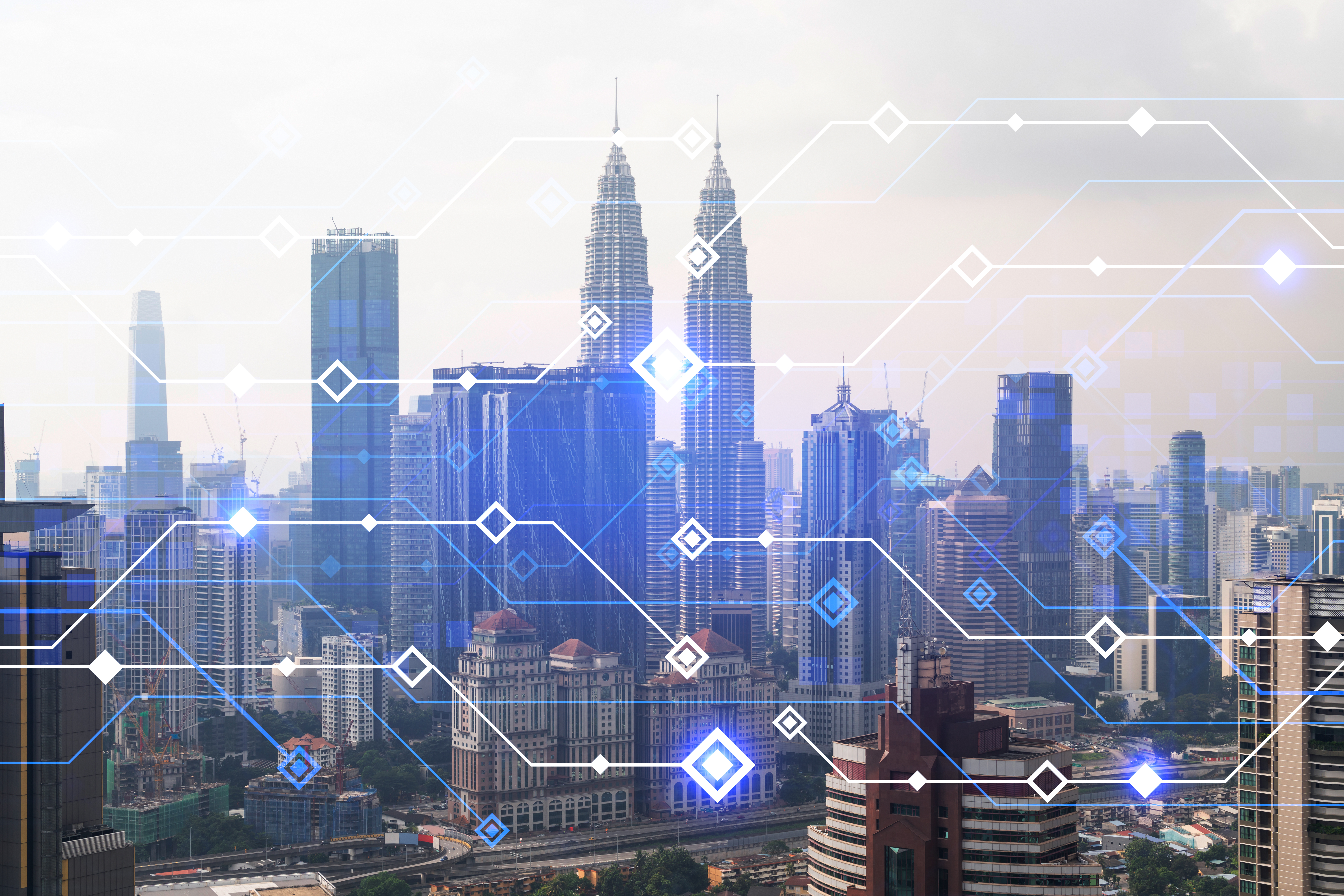 A view of a cityscape full of sky scrapers. There are lines and squares overlapping the background to give the appearance of a high-tech city.