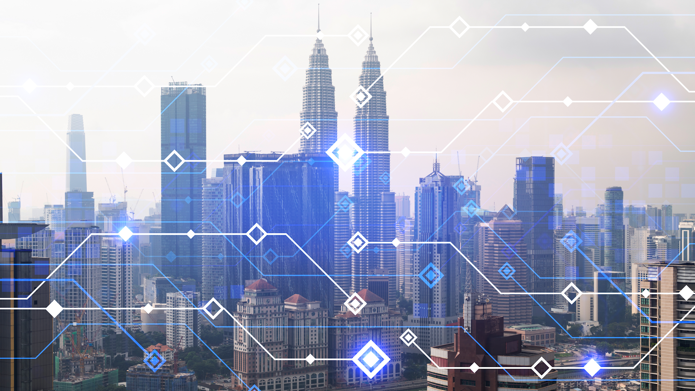A view of a cityscape full of sky scrapers. There are lines and squares overlapping the background to give the appearance of a high-tech city.