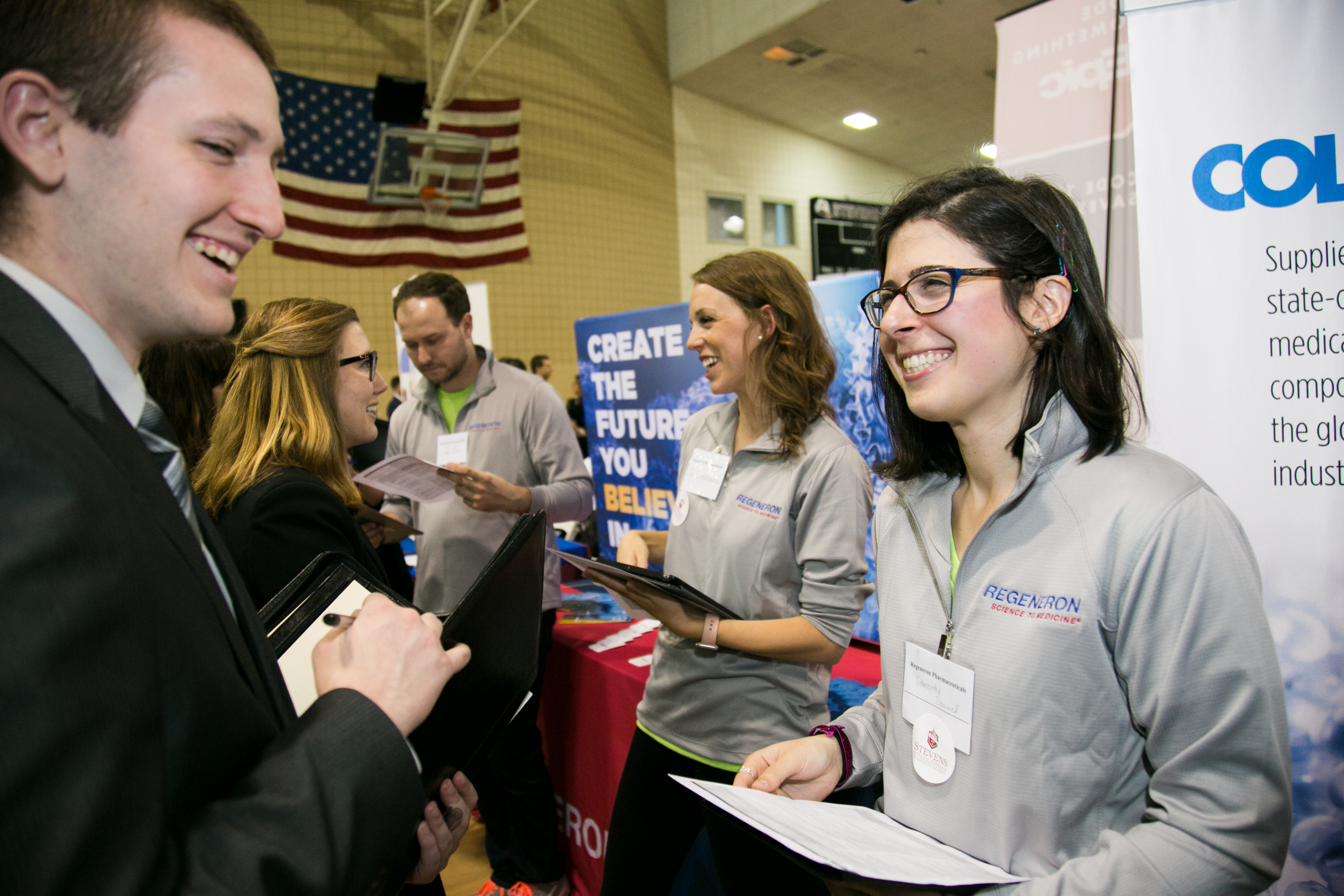 Student speaks with alum at the Career Fair 