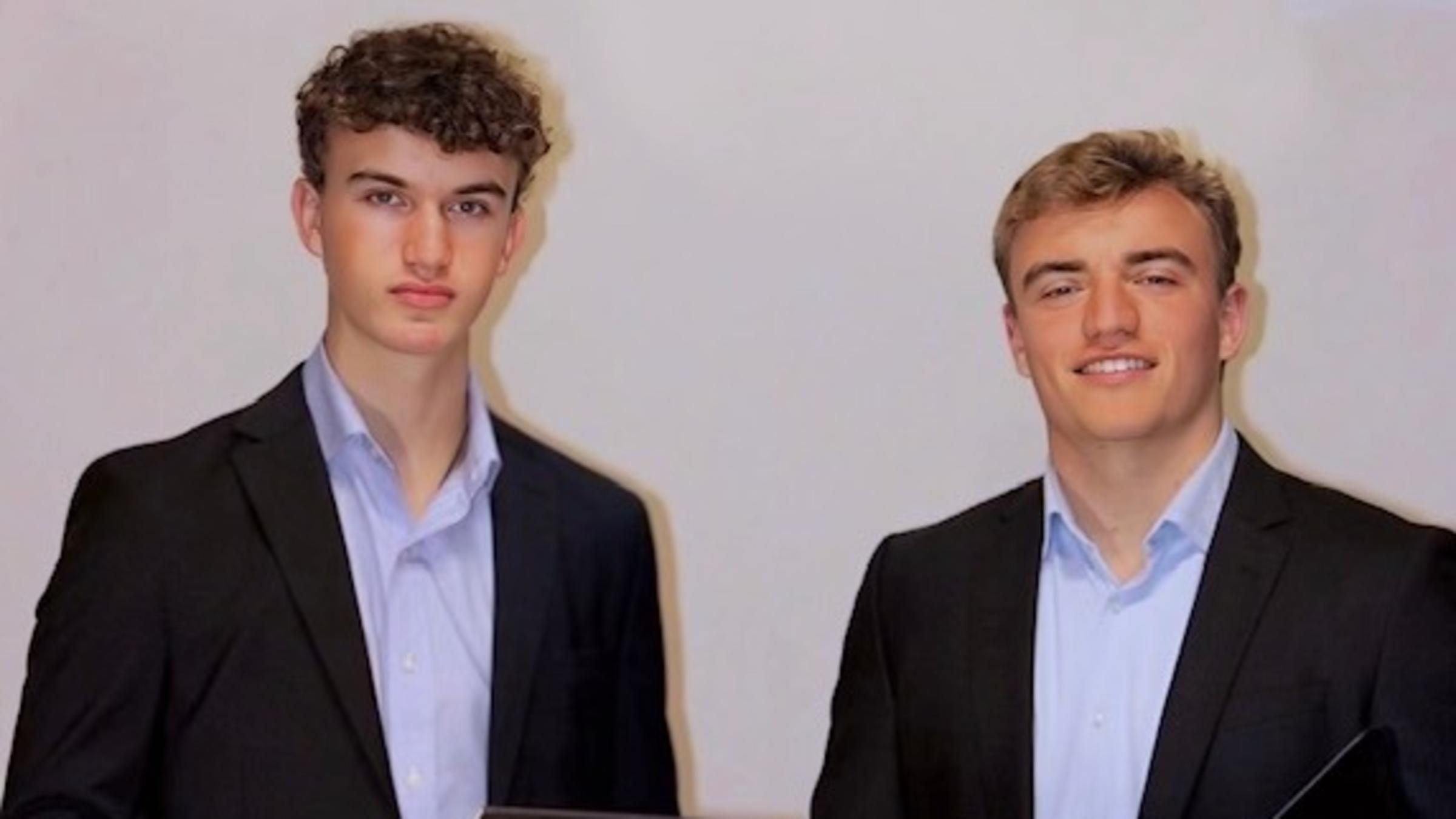 Aron Dyaduk and his brother stand next to each other.