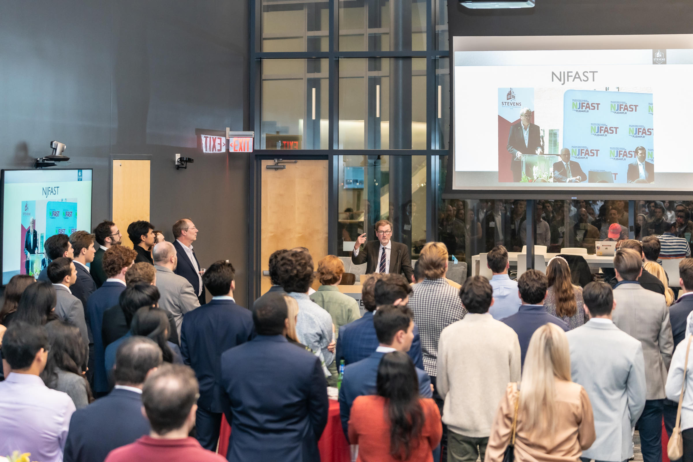George Calhoun addresses the crowd from behind a podium