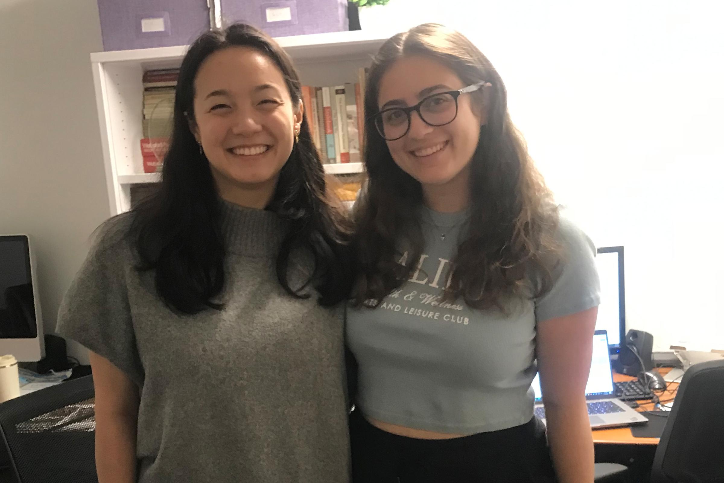 Two women smile for the camera