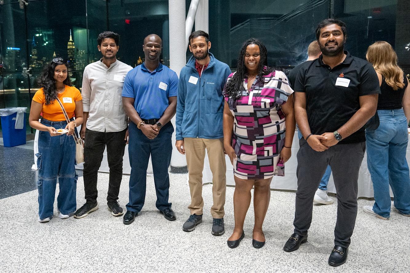 MBA students at reception in Babbio Center