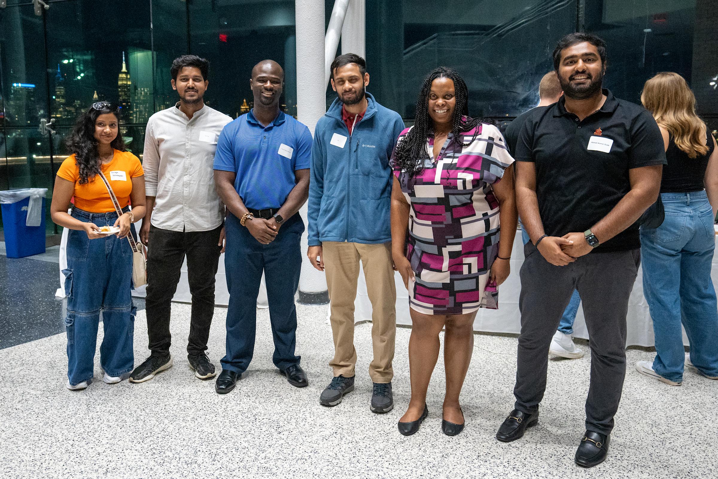 MBA students at reception in Babbio Center
