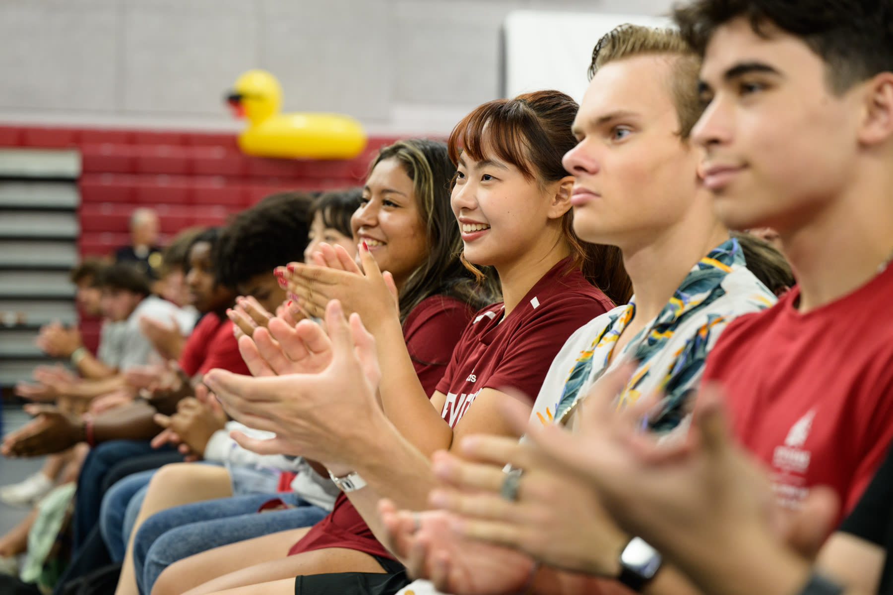 Students give applause during Convocation.