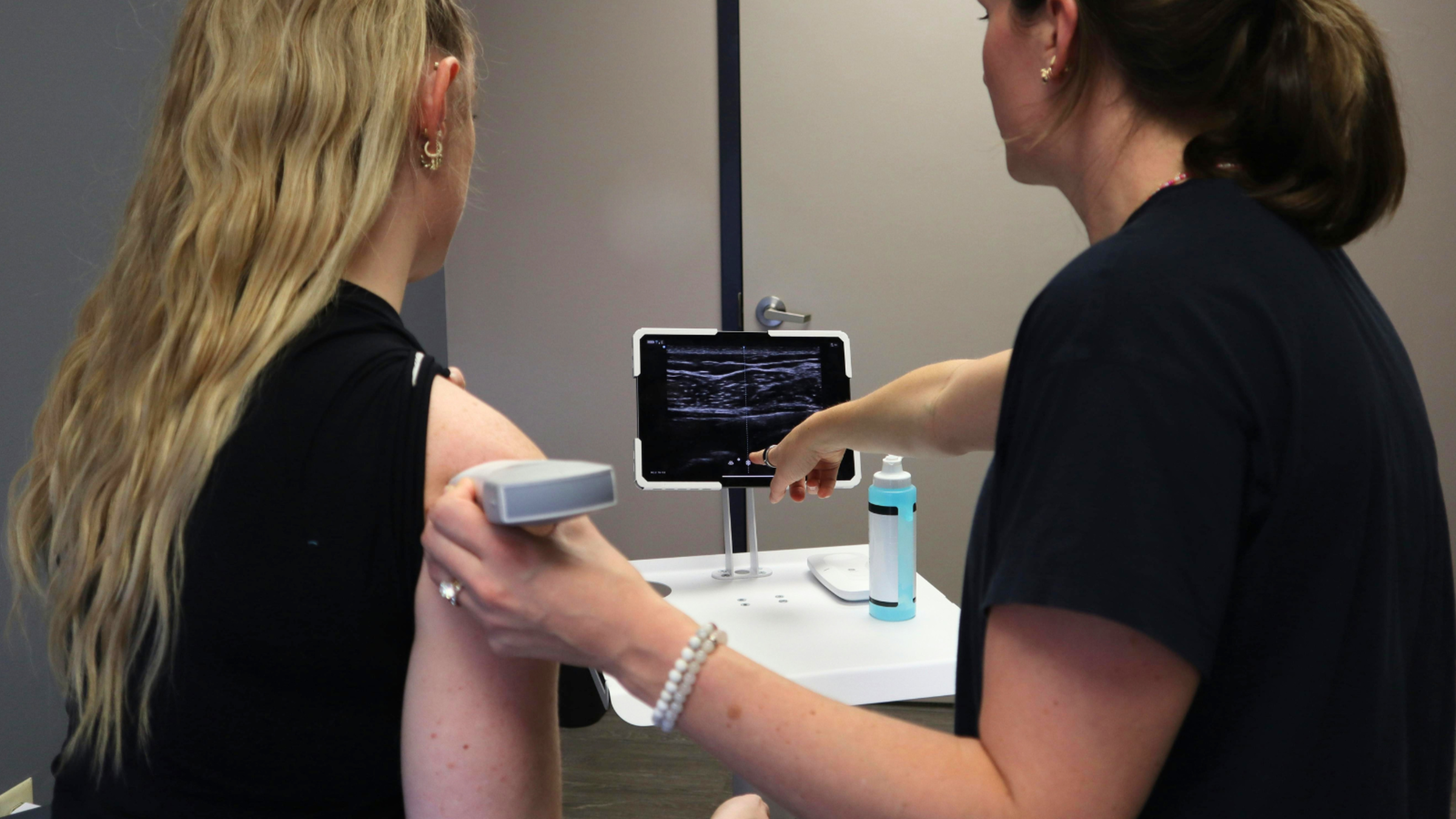 A doctor and patient looking at a monitor.