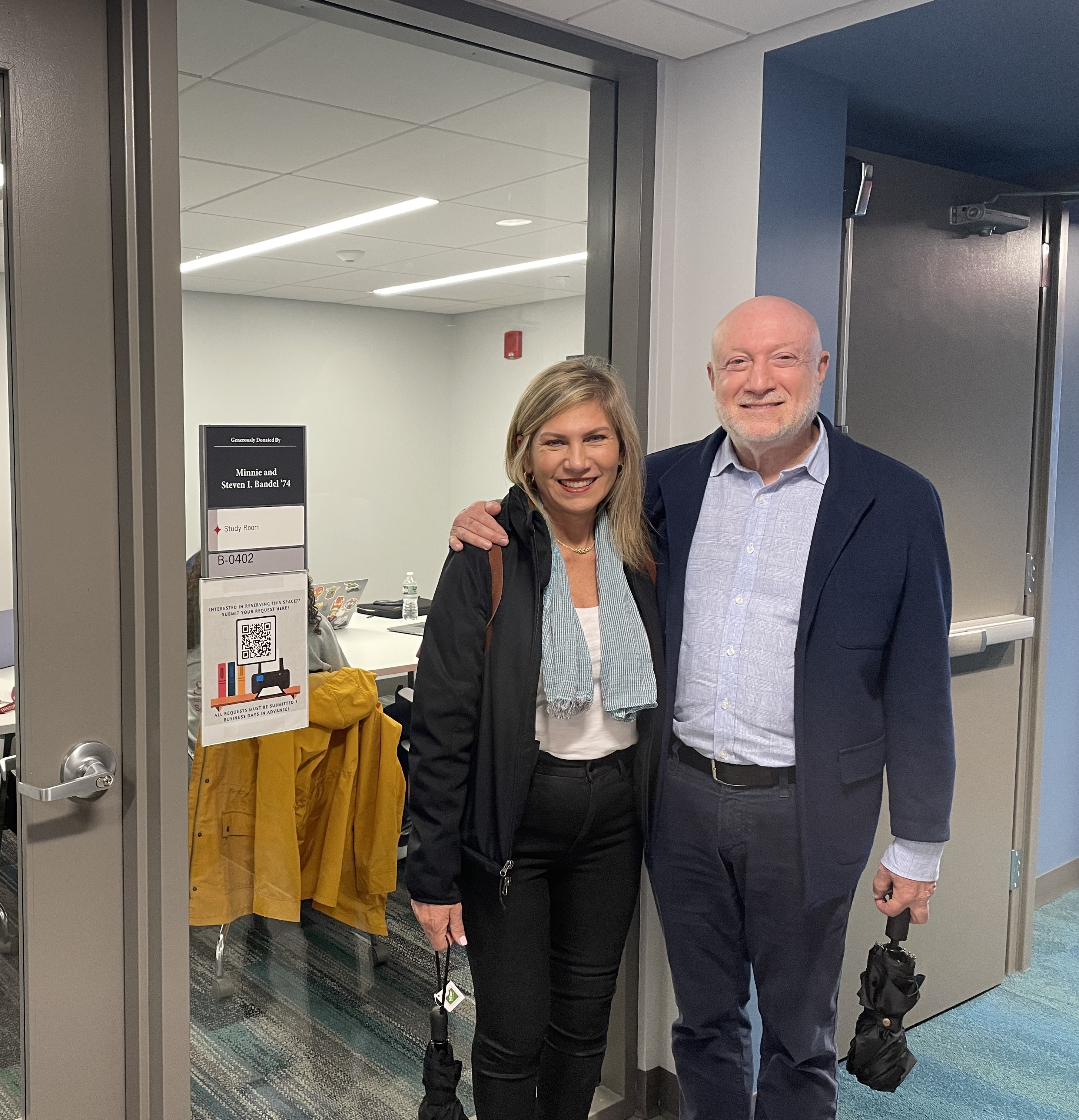 Steven I. Bandel ’74 and Minnie stand outside of their named space within the University Center Complex