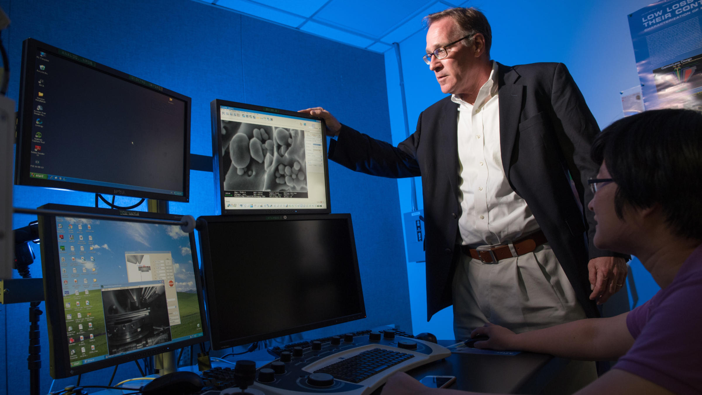 Professor Matt Libera looks at a computer monitor.