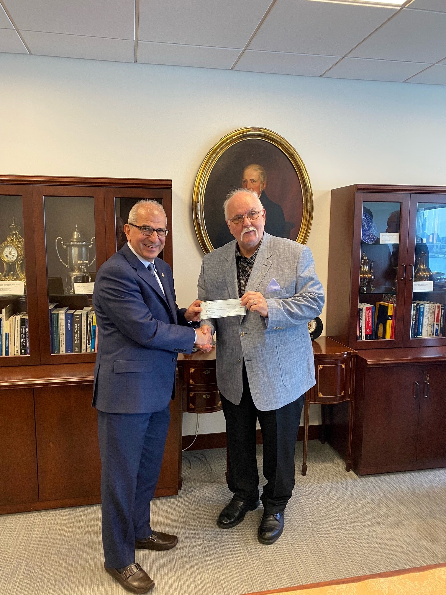 President Nariman Farvardin with Steve Standler, executor of the estate of Reno Del Ben ’58.