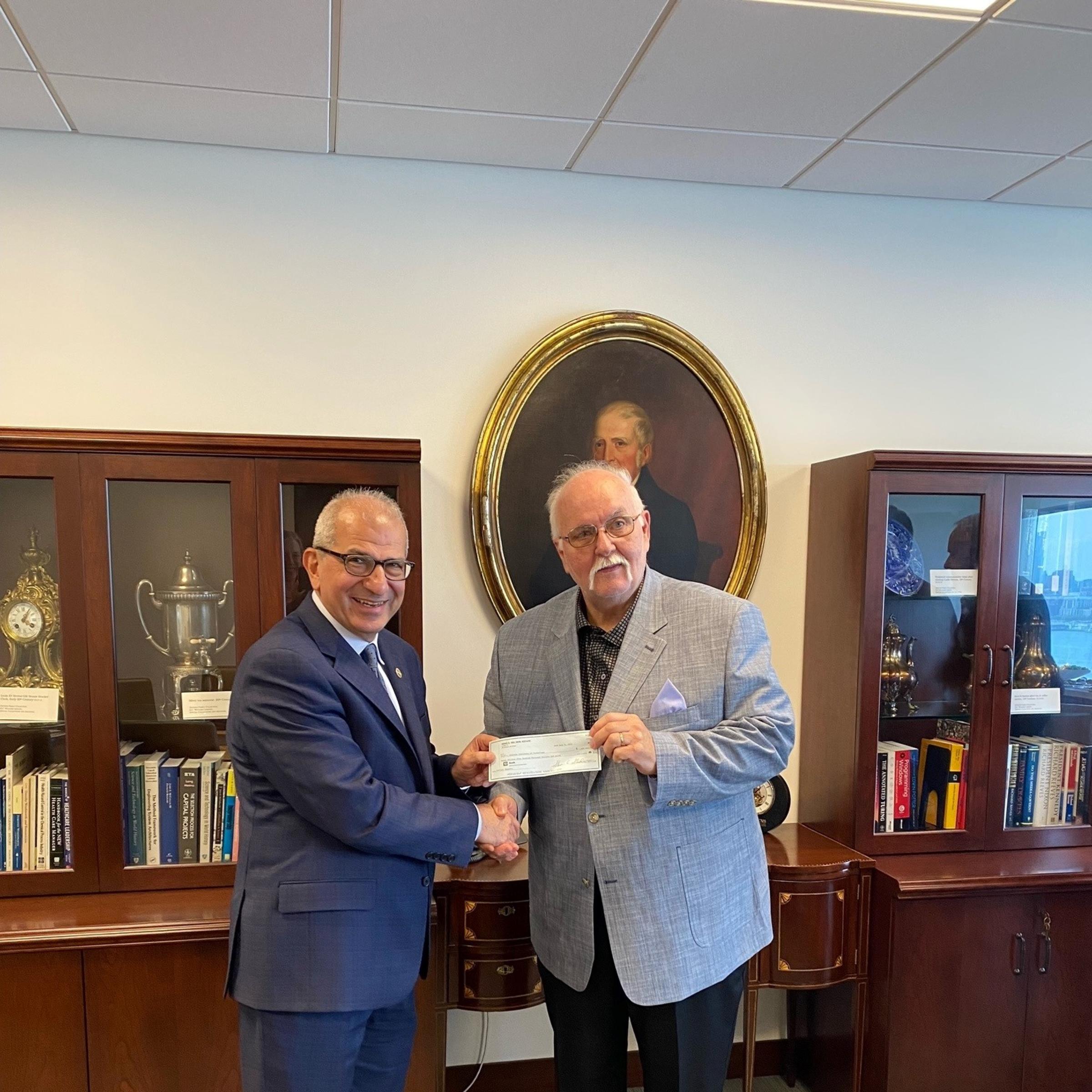 President Nariman Farvardin with Steve Standler, executor of the estate of Reno Del Ben ’58.