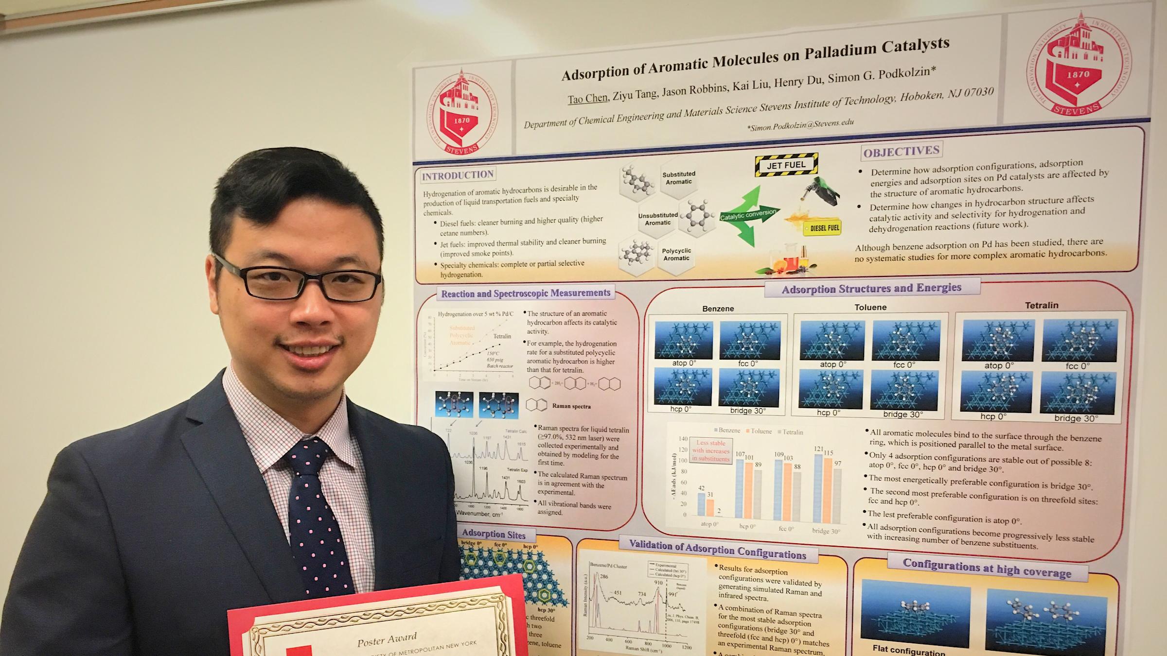 Tao Chen holding award in front of poster