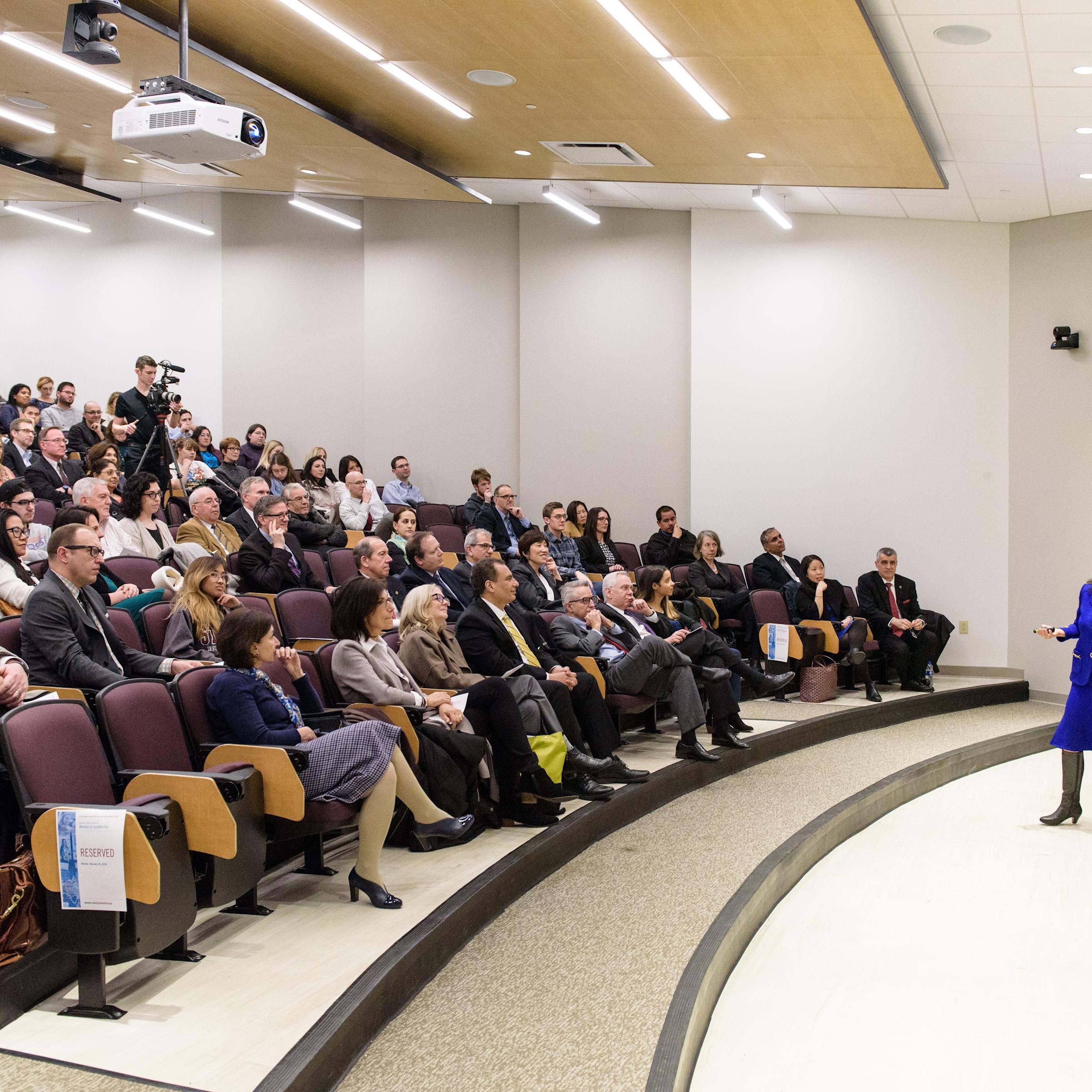 People listen to lecture