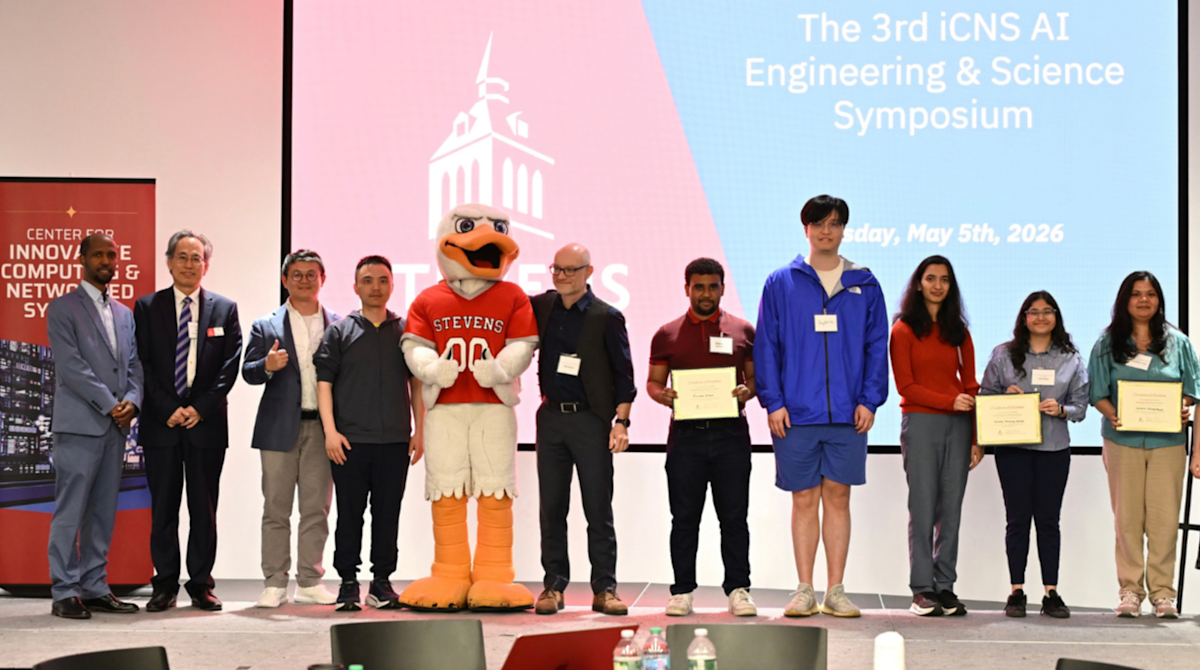 Professor Min Song and a group of student research winners on stage.