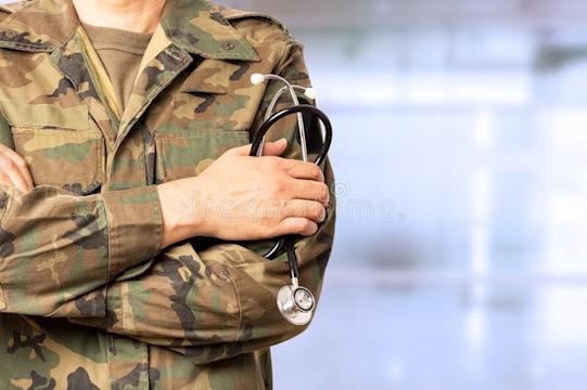 Army solider holding stethoscope