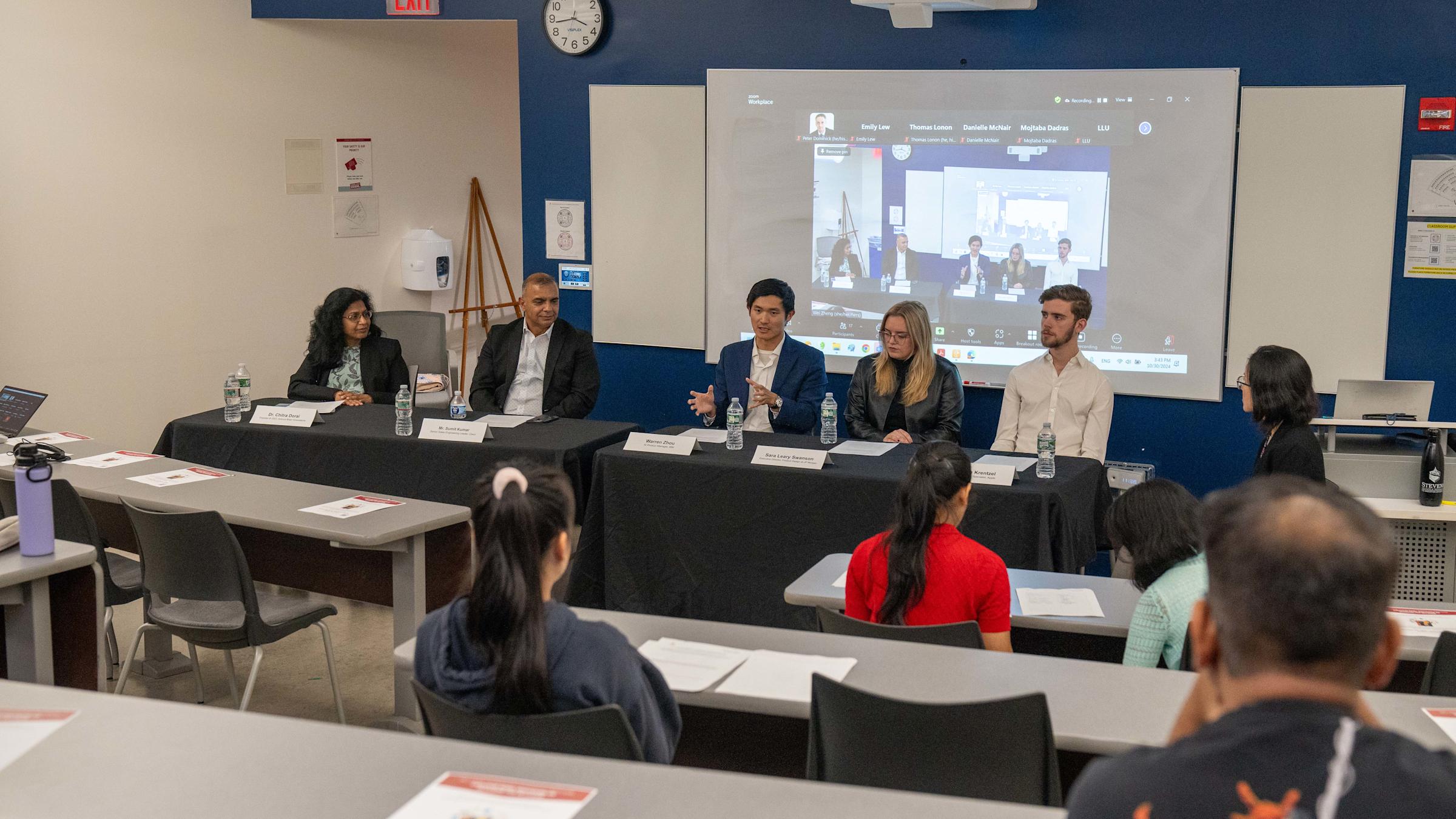 Panel of inclusive design experts speak with students in a classroom