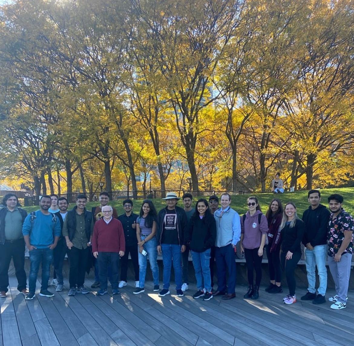 Walk & Talk group standing in front of trees 