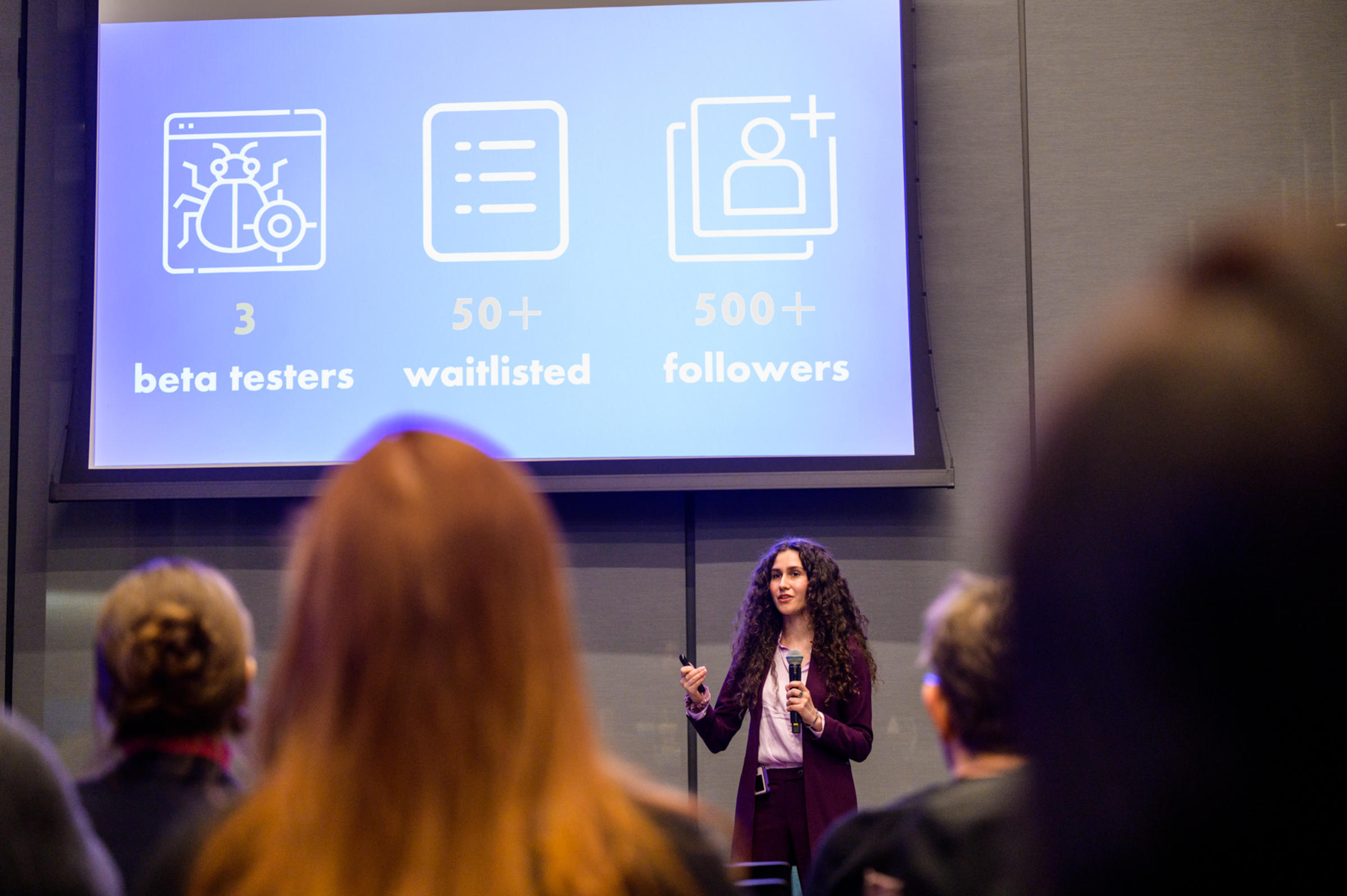 An alum gives a presentation at a career development event