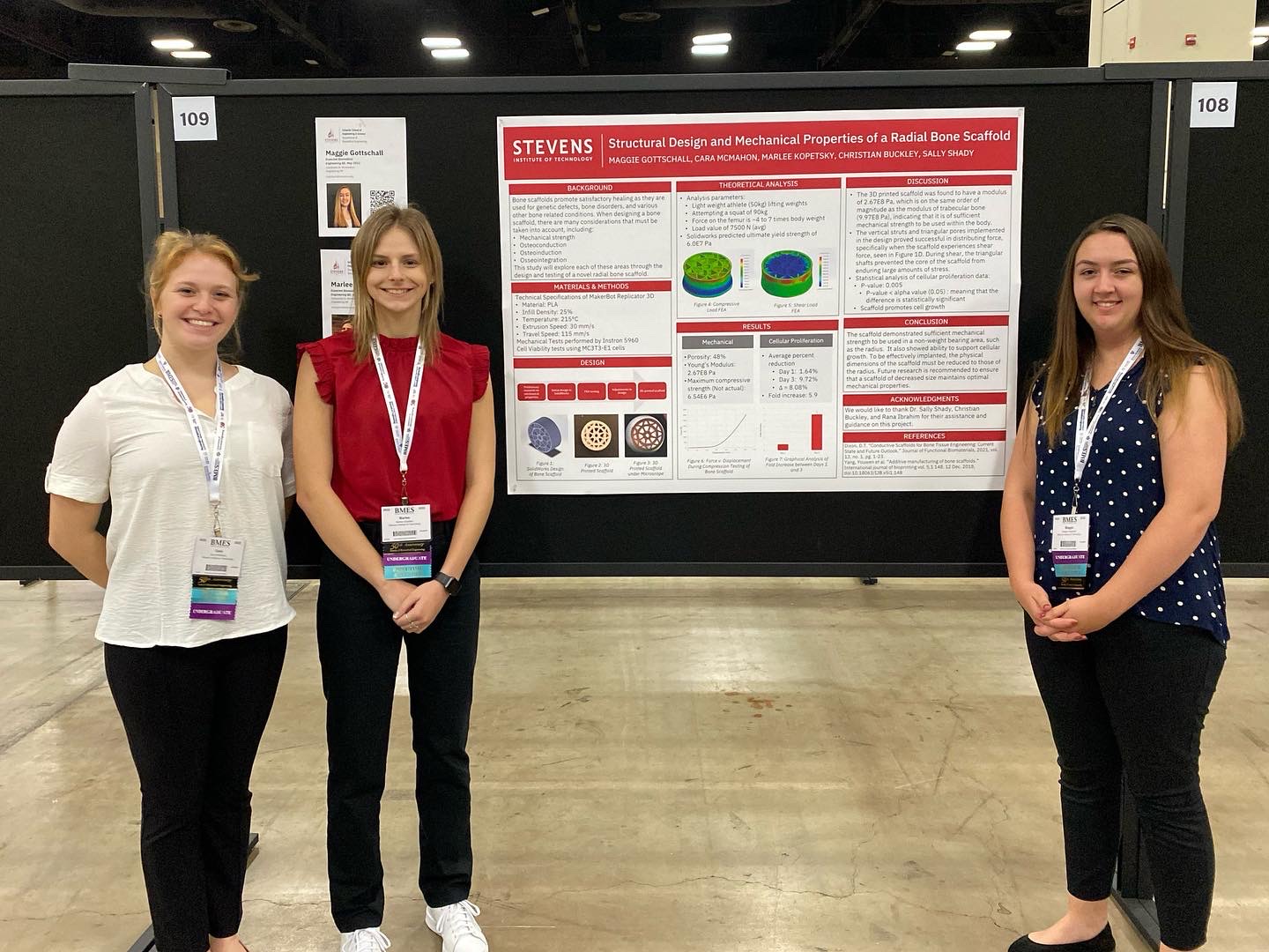 Cara McMahon ‘24, Marlee Kopetsky ‘23 and Maggie Gottschall ‘23 stand next to their poster at the 2022 Biomedical Engineering Society Conference
