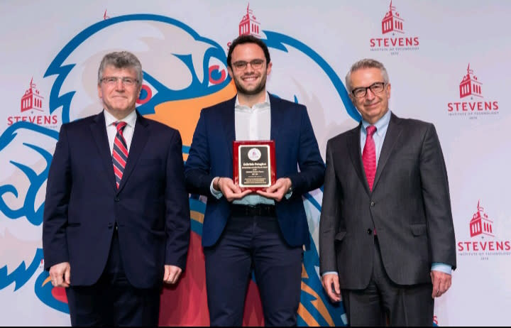 Emmanuel Hatzakis, Gabriele Petagine and Gregory Prastacos. Gabriele is in the middle holding his award.